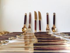 Danish Mid-Century Brass and Teak Cutlery, Flatware Set, 36 Pieces by Carl Cohr
