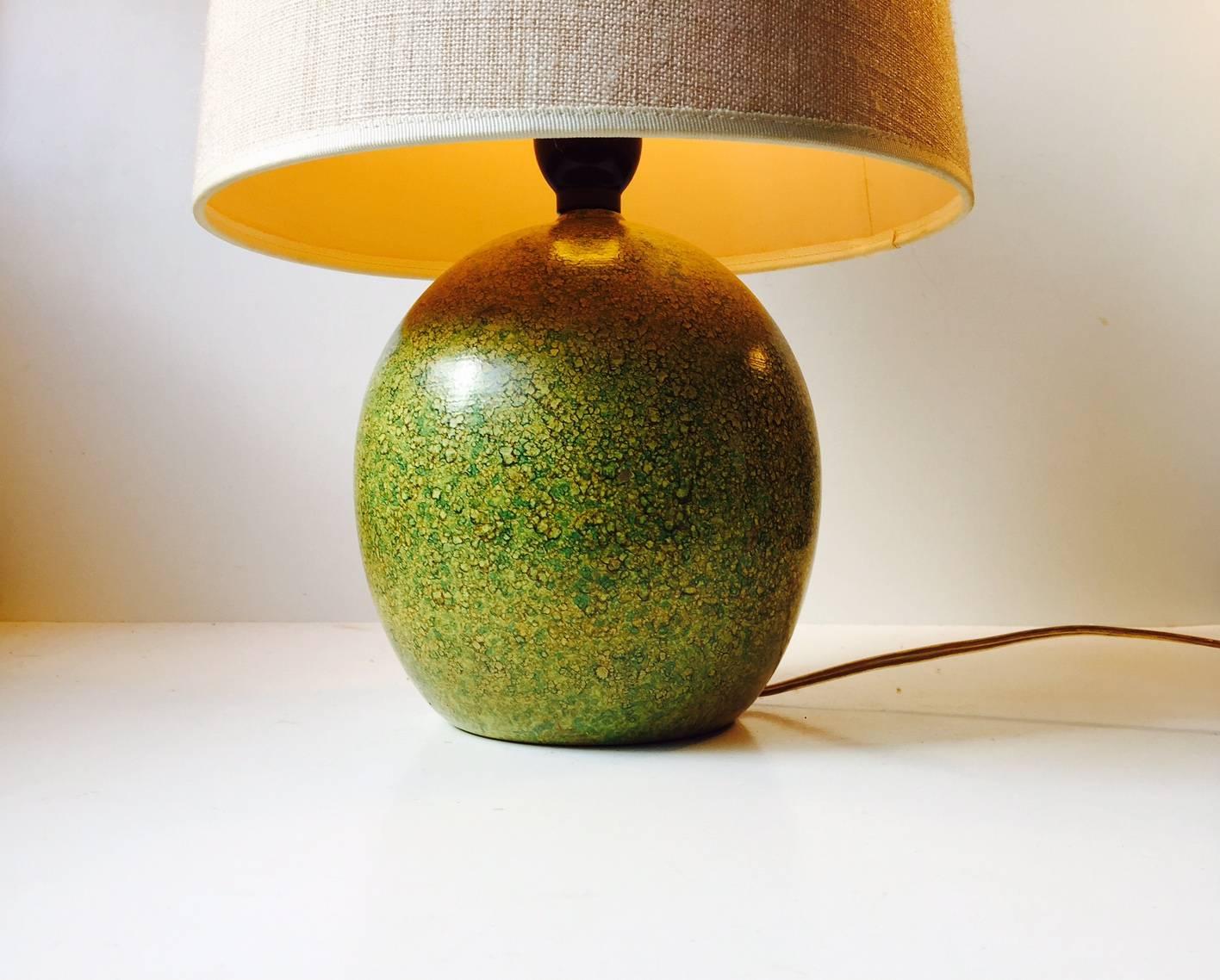 Playfully glazed pottery table light in the style of Jean Besnard. Designed and created by anonymous designer/maker in France during the 1920s. No marking or signature to the base.