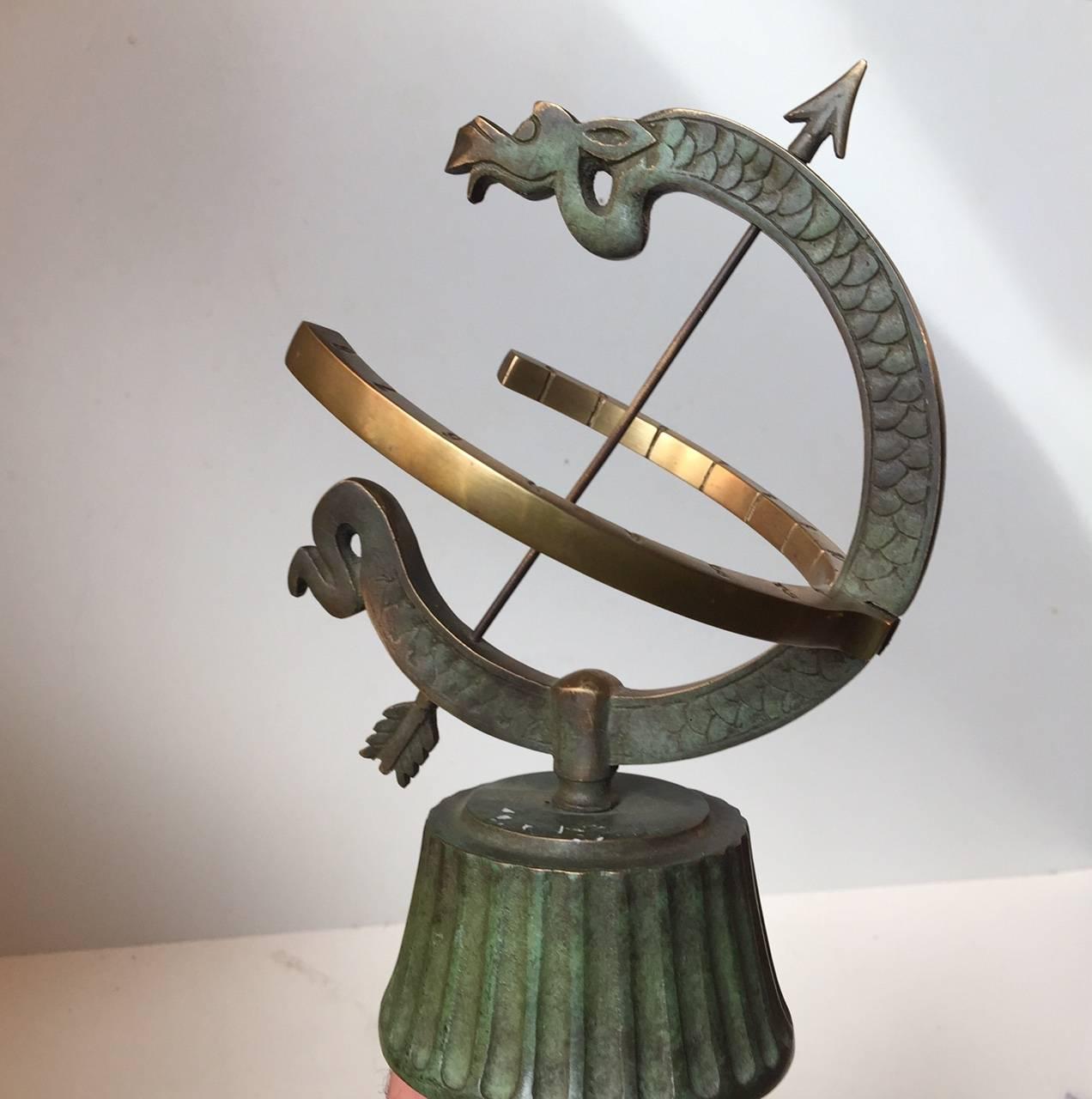 Handcrafted Armillary/Sundial with green verdigris patinated dragon, fluted base and arrow. Manufactured in Denmark during the 1940s by Nordisk Malm.