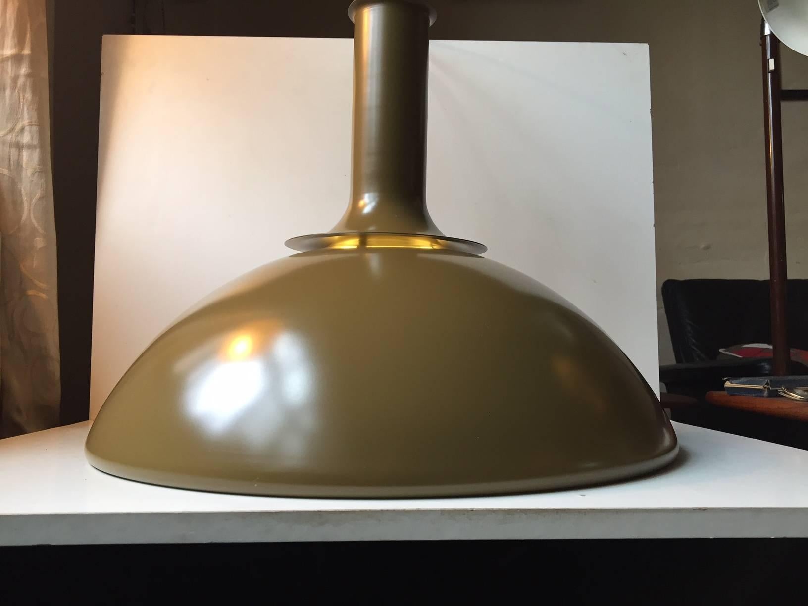 A large dark olive green Danish pendant ceiling light called Ballerina. It was designed by Sidse Werner and manufactured by Holmegaard in Denmark during the 1970s. It is composed of powder-coated aluminum. The label from the maker is still present