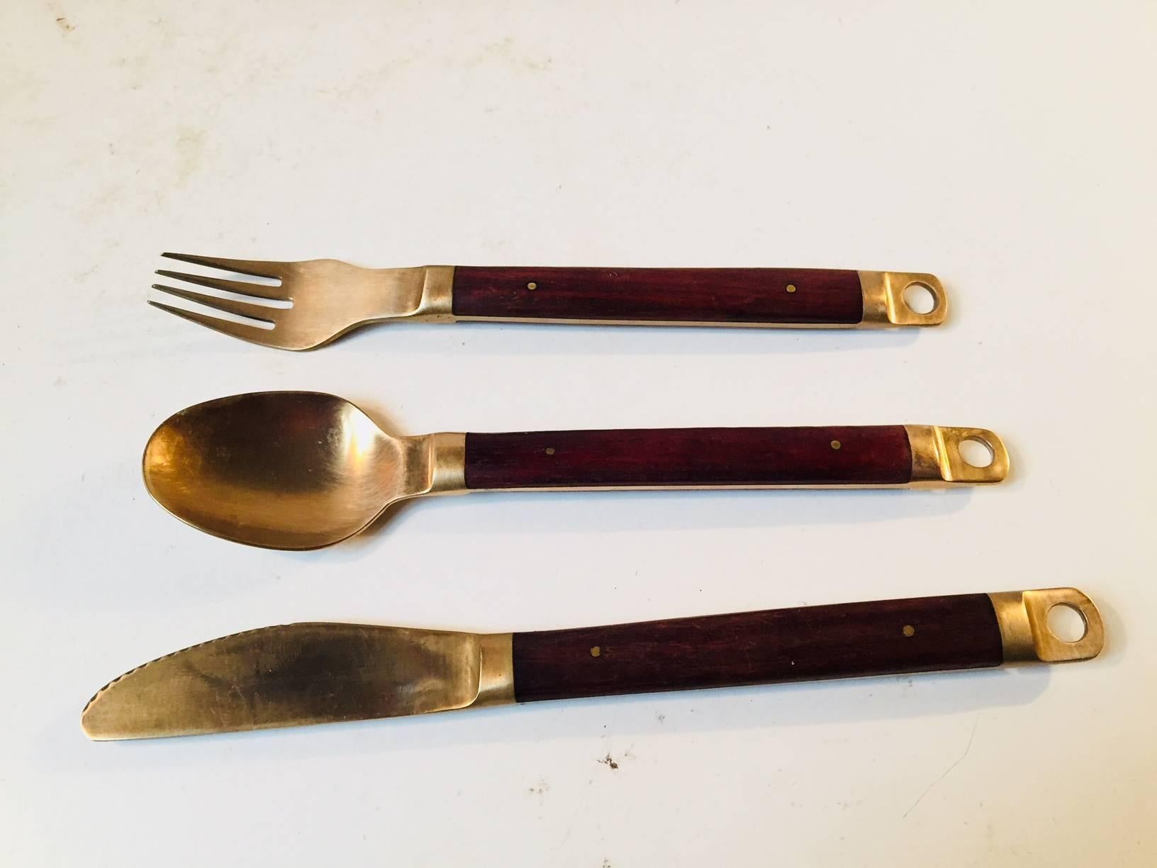This dining/lunch set by Carl Cohr was manufactured and designed in Denmark in the 1960s. The set consists of three x eight and two pieces dinner/lunch, knives, forks, spoons and a salad set. A rather practical feature of the design is the hole to