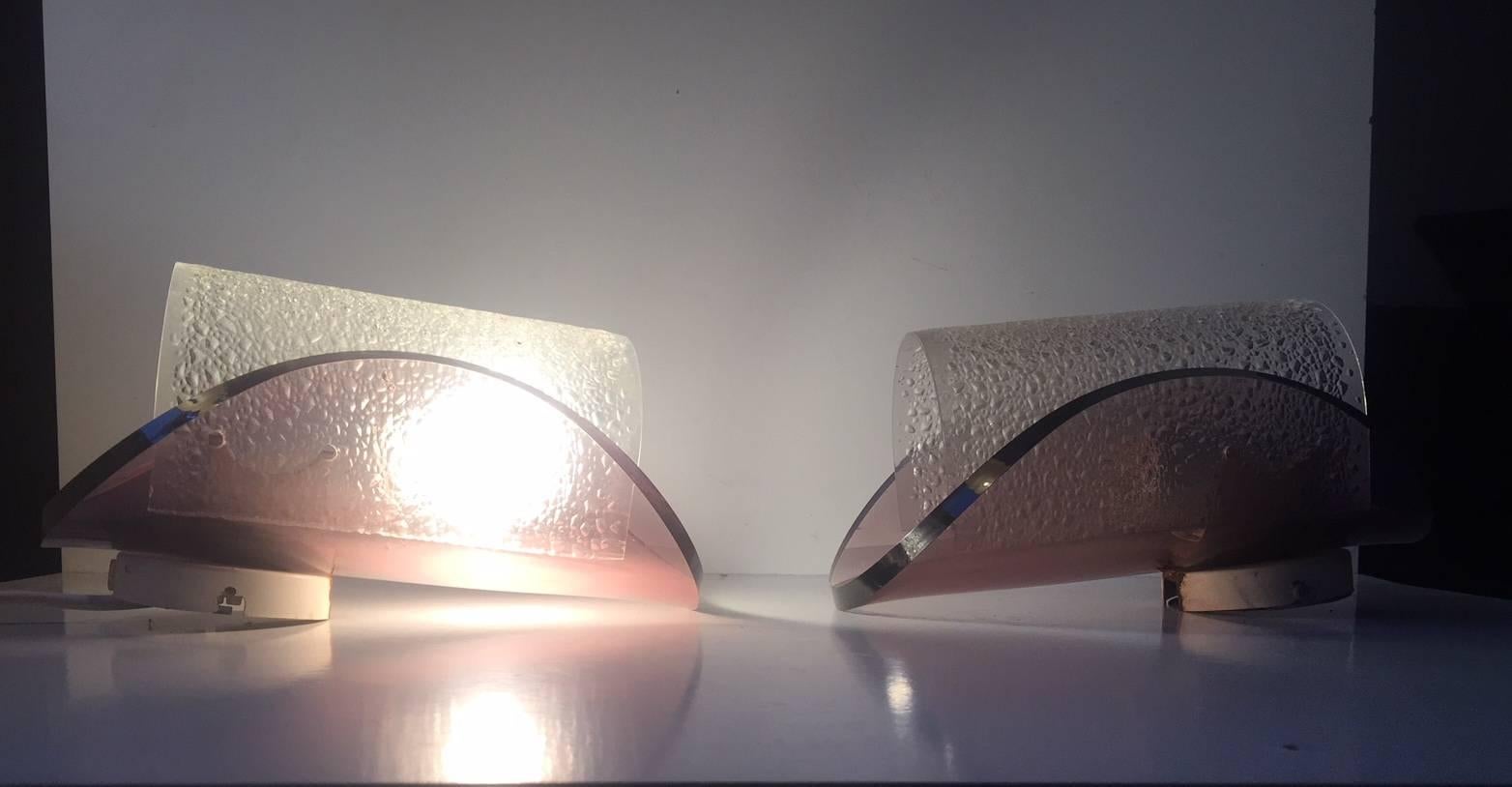 A pair of purple bend lucite wall lights. Manufactured and sold via Sönnico in Oslo Norway. Anonymous designer in the style of Gino Sarfatti for Arteluce. The lights features original porcelain sockets.