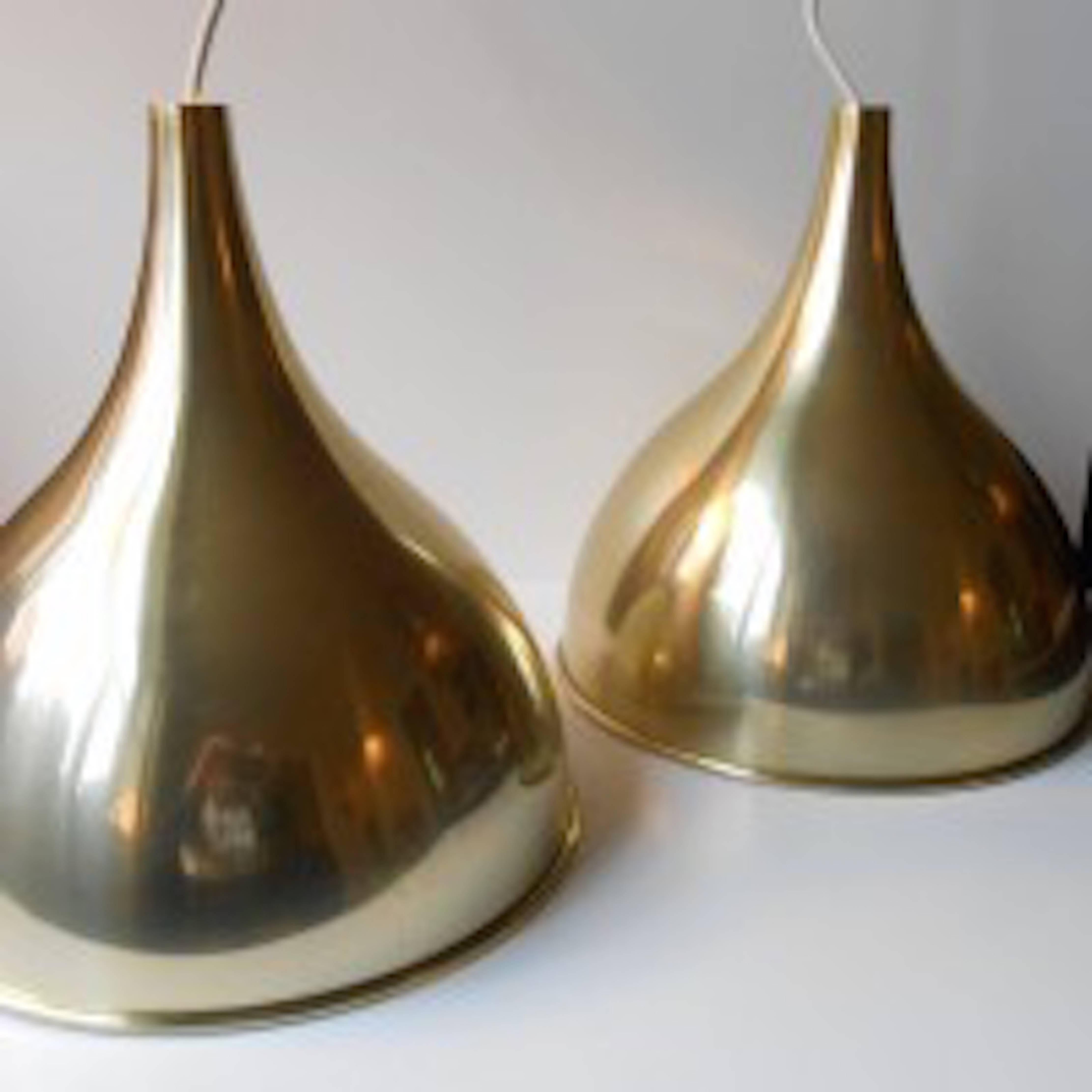 A pair of 'Silhuet 2' pendant lamps by Jo Hammerborg. Organically-shaped brass with white interior. Manufactured by Fog & Mørup, Denmark. Measurements: Height 13 inches (32 cm), diameter 12 inches (30 cm).