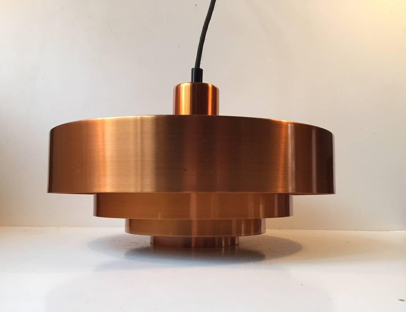 This solid copper pendant lamp was designed by Johannes Hammerborg for Fog & Mørup, Denmark and released as 'Roulet' in the early 1960s. It is one of Hammerborg earliest designs. Nice vintage condition with light ware and even patina to the copper.