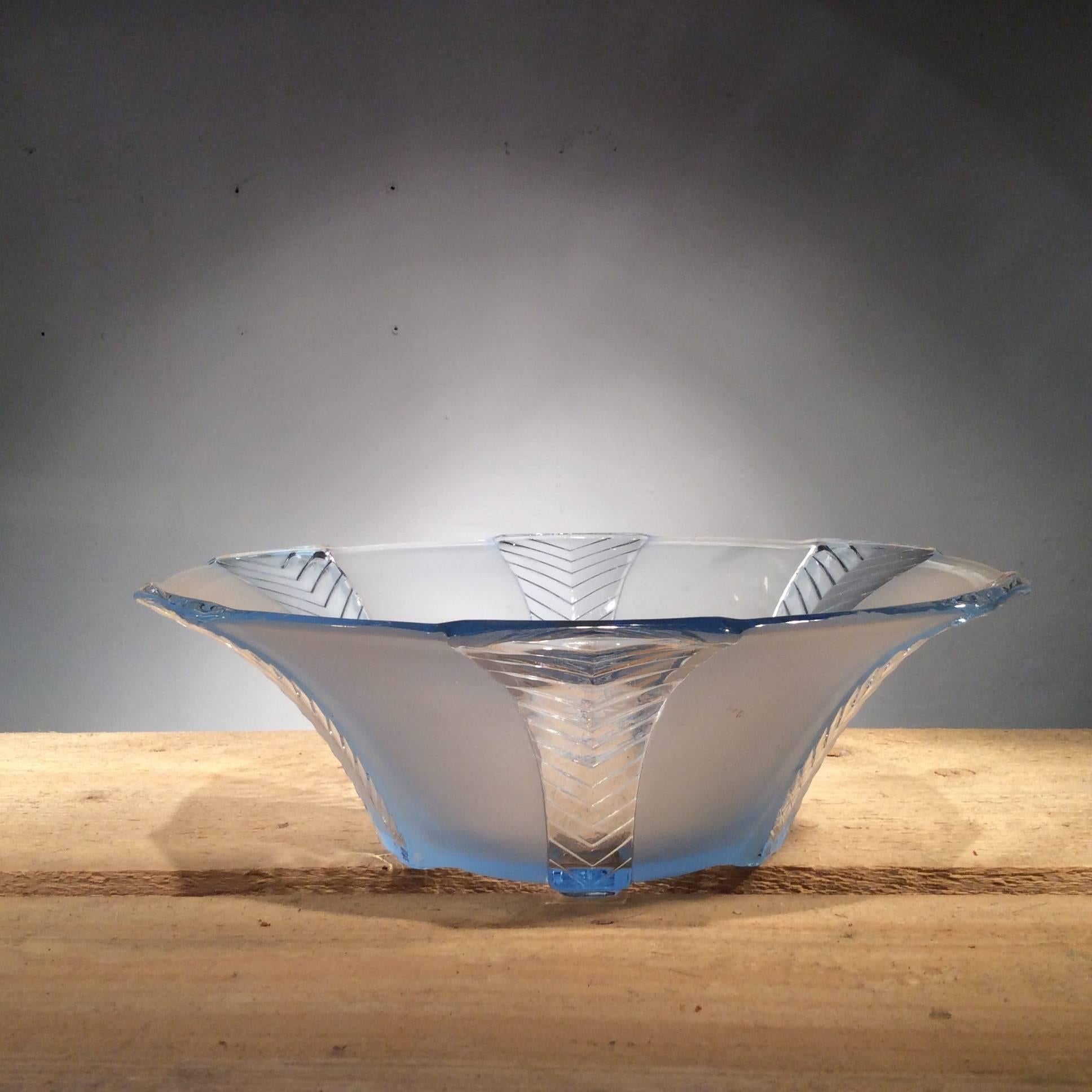 Striking 1930s frosted and clear blue glass serving bowl comes complete with a set of four individual bowls and saucers. Perfect for serving up colorful fruit salads or purely for decoration.

In excellent condition this Art Deco set is a real