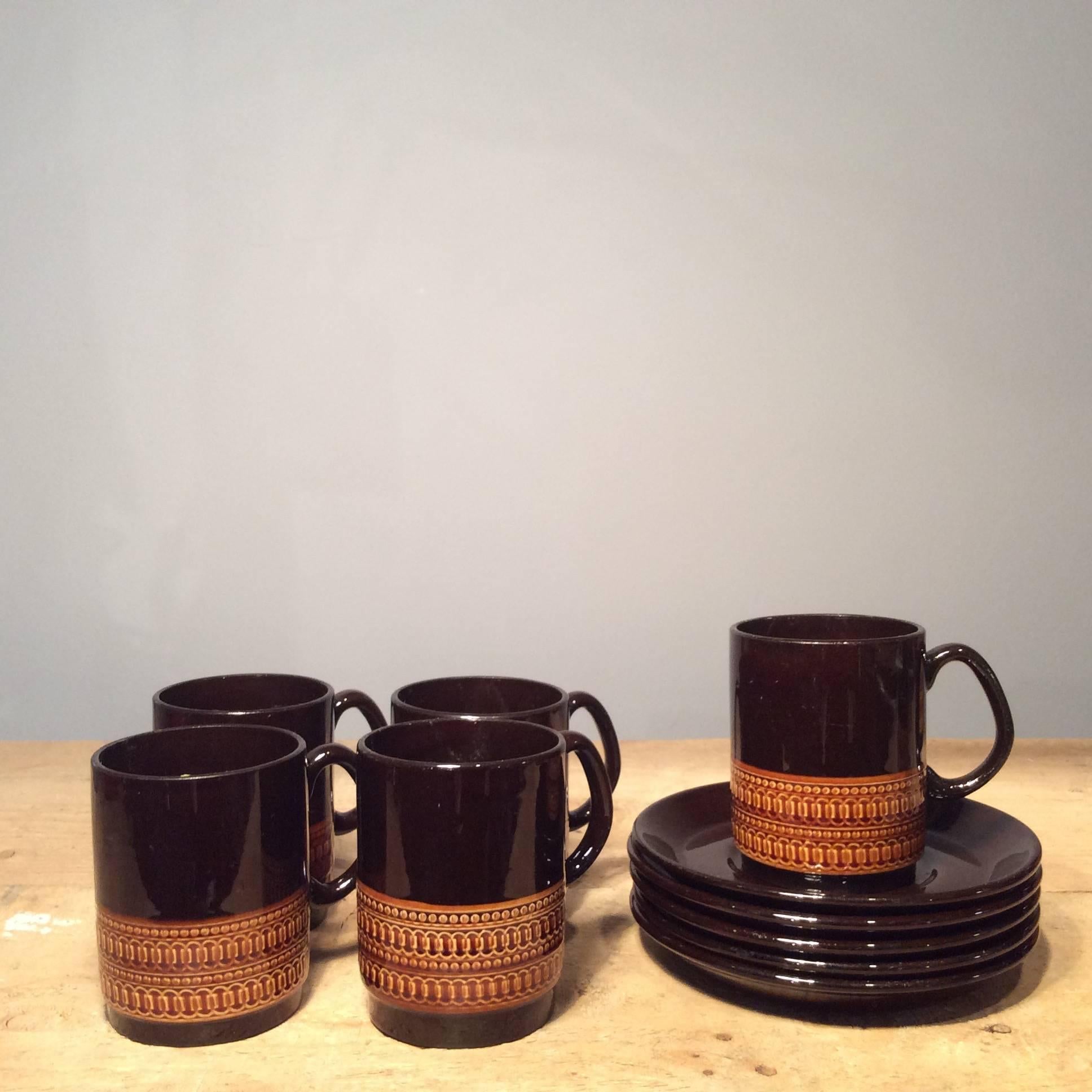 Elegant brown vintage coffee set with repeat design and simple silhouette.

Pot: Height 23cm, diameter 11cm.
Mug: Height 8.5cm, diameter 6.5cm.
Milk jug: Height 8.5cm, diameter 6.5cm.
Sugar bowl: Height 6cm, diameter 8cm.
Saucer: Diameter