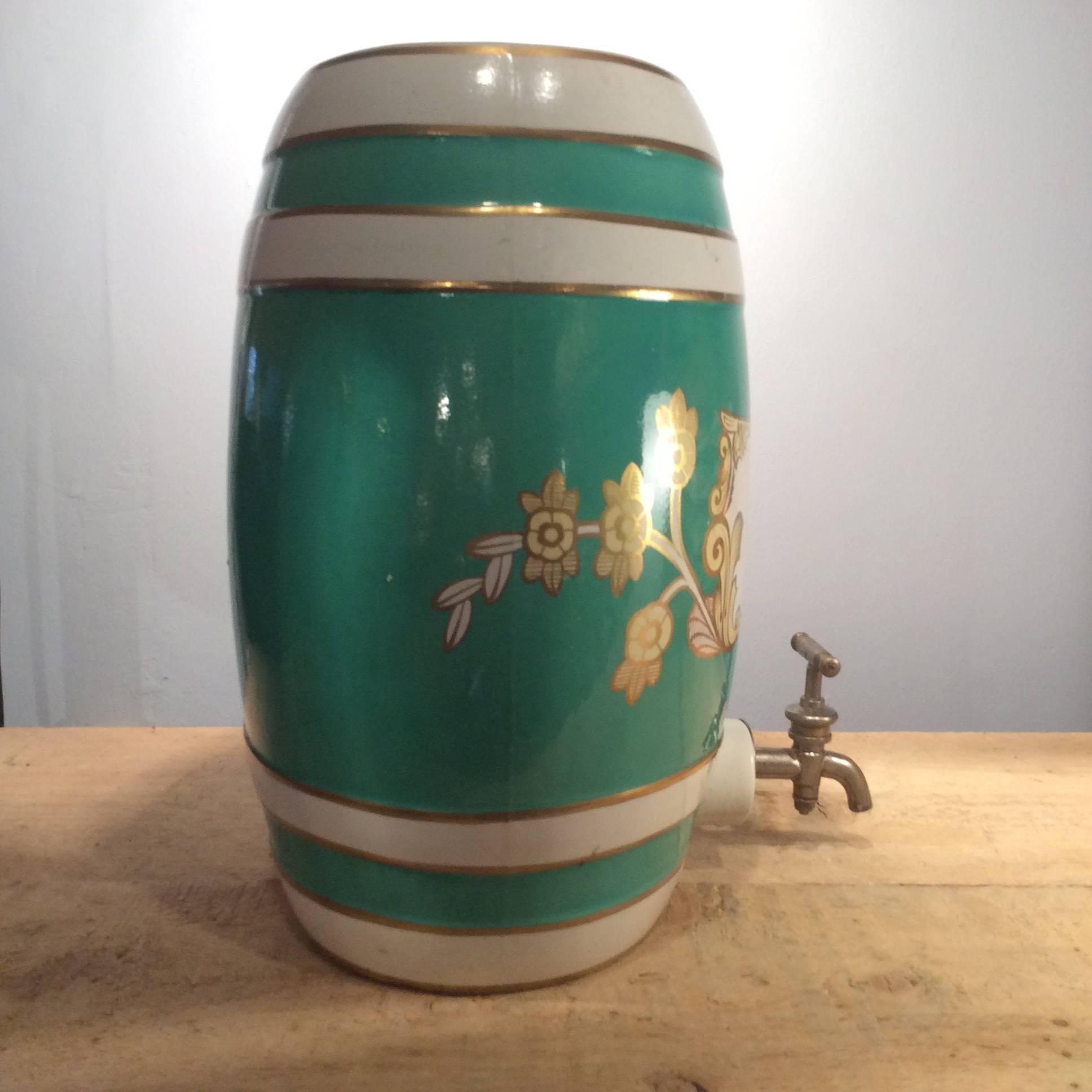Vintage Wade S. Whiskey barrel by Royal Victoria Pottery in beautiful teal with gold band detailing and classic scroll work around the label.

Dimensions:

Height 34cm, width 17cm, length 28cm.