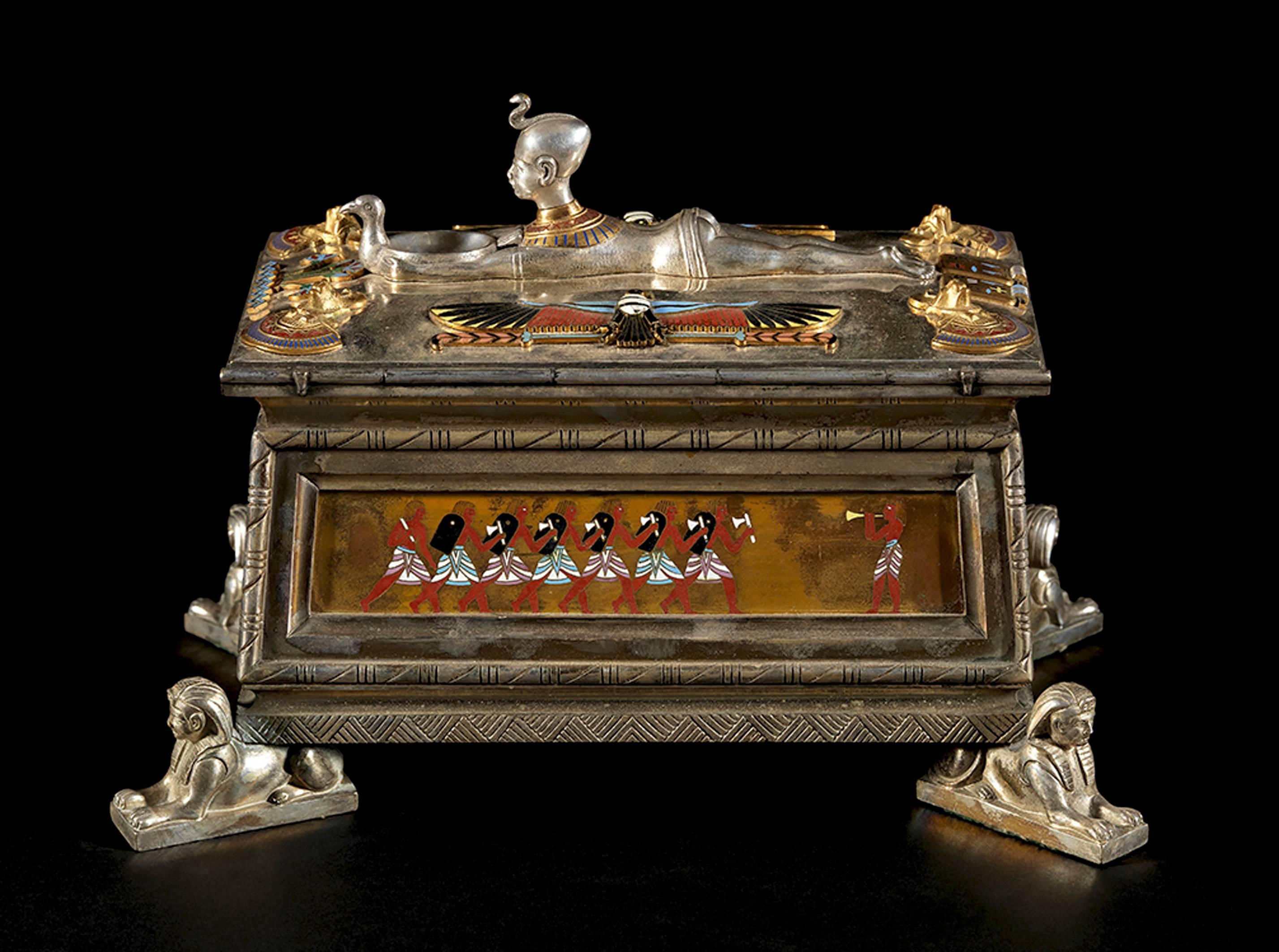 This precious Egyptian Revival Silvered and Gilt Metal Cloisonné Enamel Casket is attributed to the jeweler Gustave Baugrand (Paris, 1827-1890).

France, Napoleon III period, circa 1867.

An imposing clock by Baugrand, exhibited in Paris during the