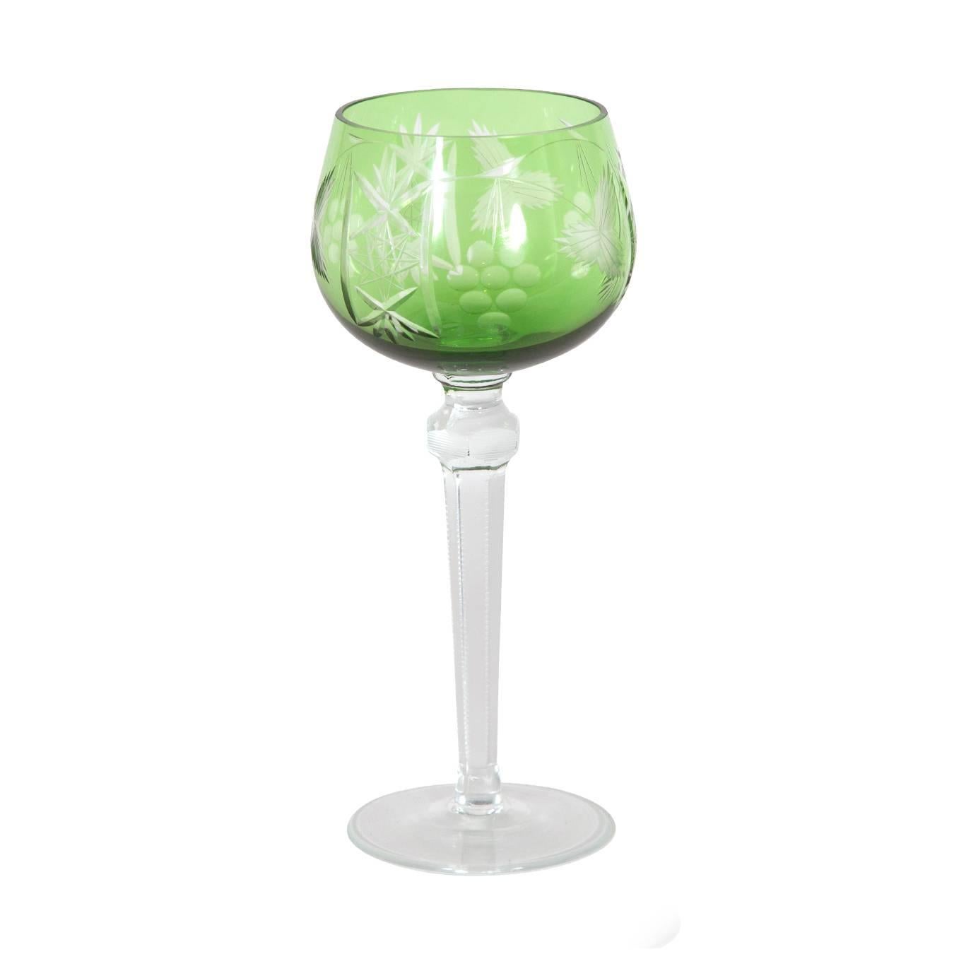Set of four emerald etched glass goblets.