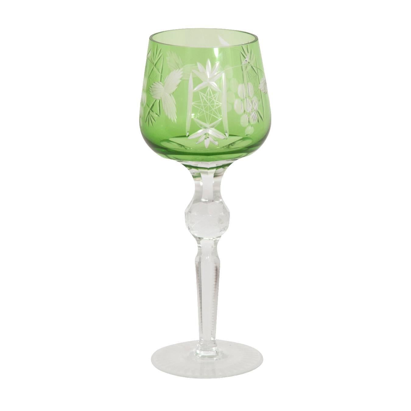 Set of 11 emerald etched crystal stemware.