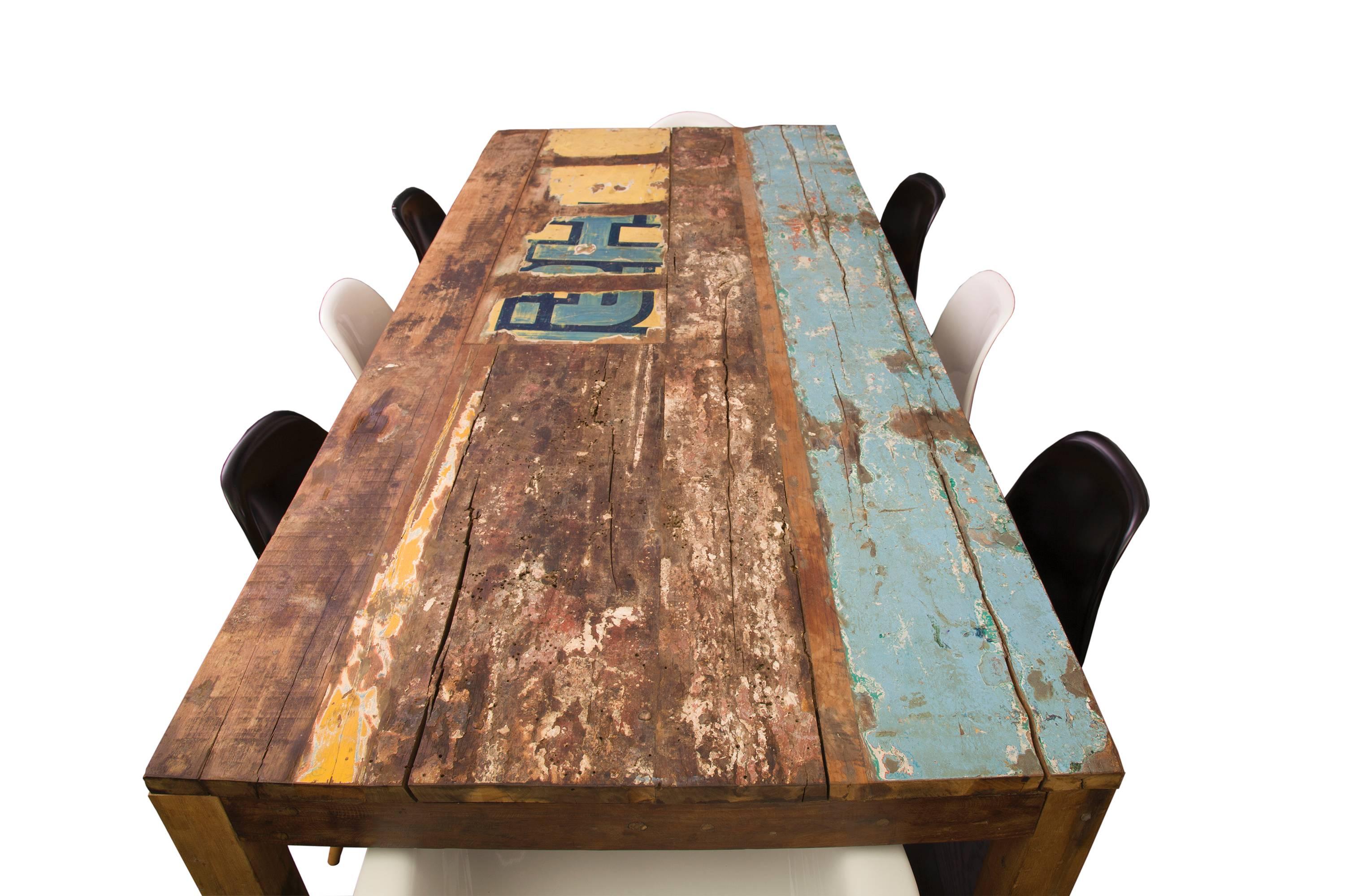 Reclaimed Indonesian fishing boat dining table.

Dining chairs for photo/display purposes only.