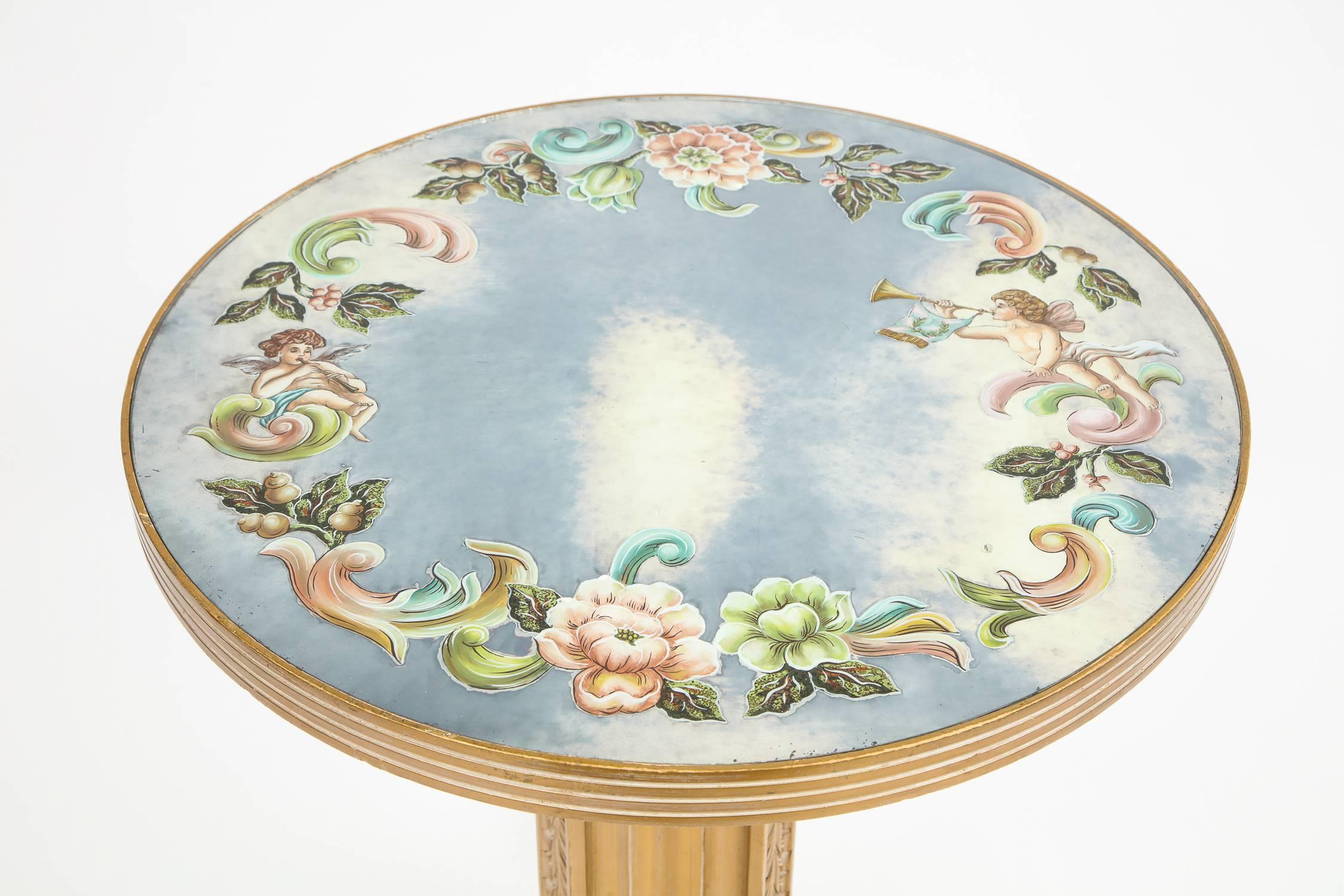 Vintage Verre églomisé centre or accent table, with substantial hand-carved wood scroll base.