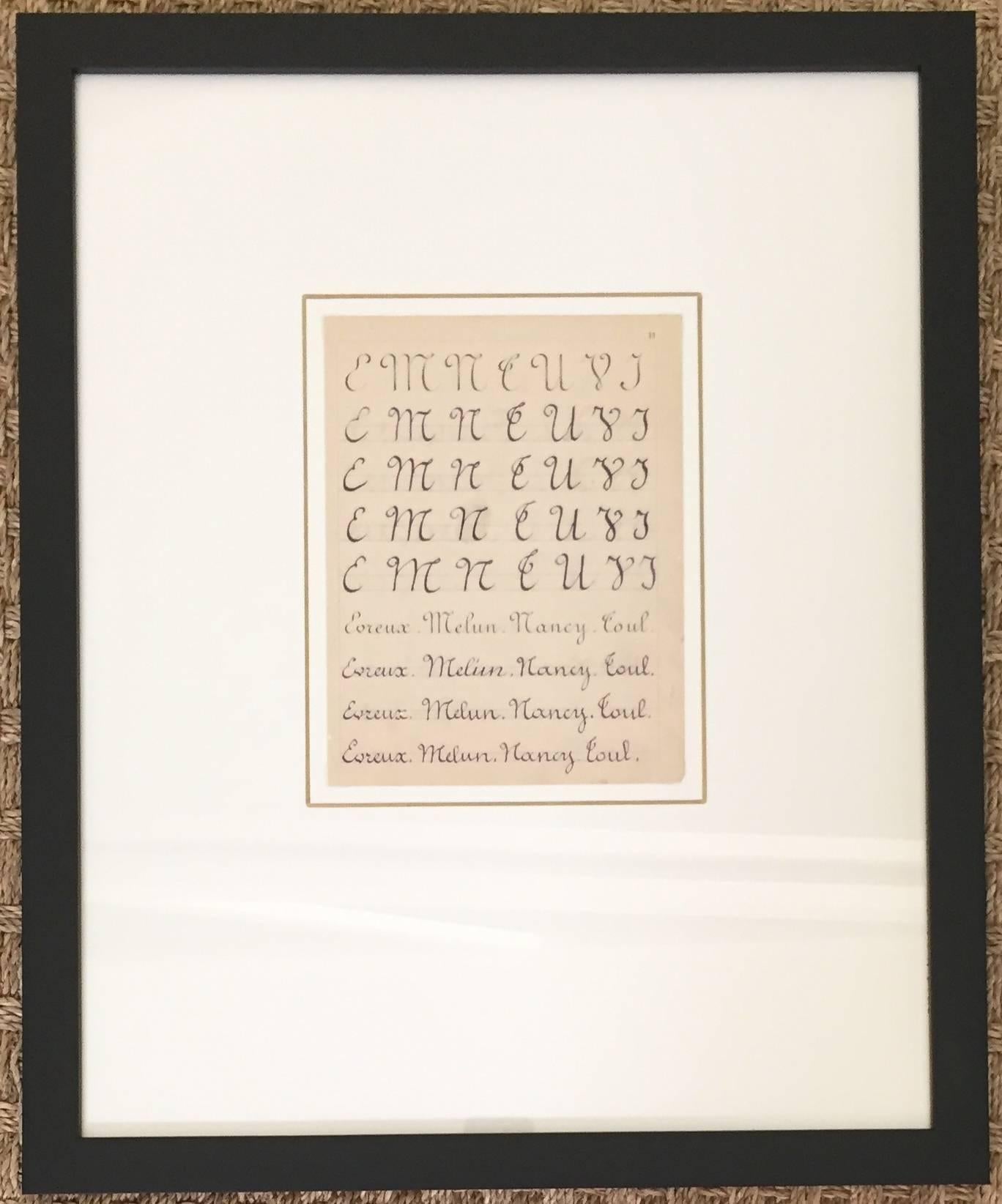 Collection of French alphabet lessons framed in black square frames.