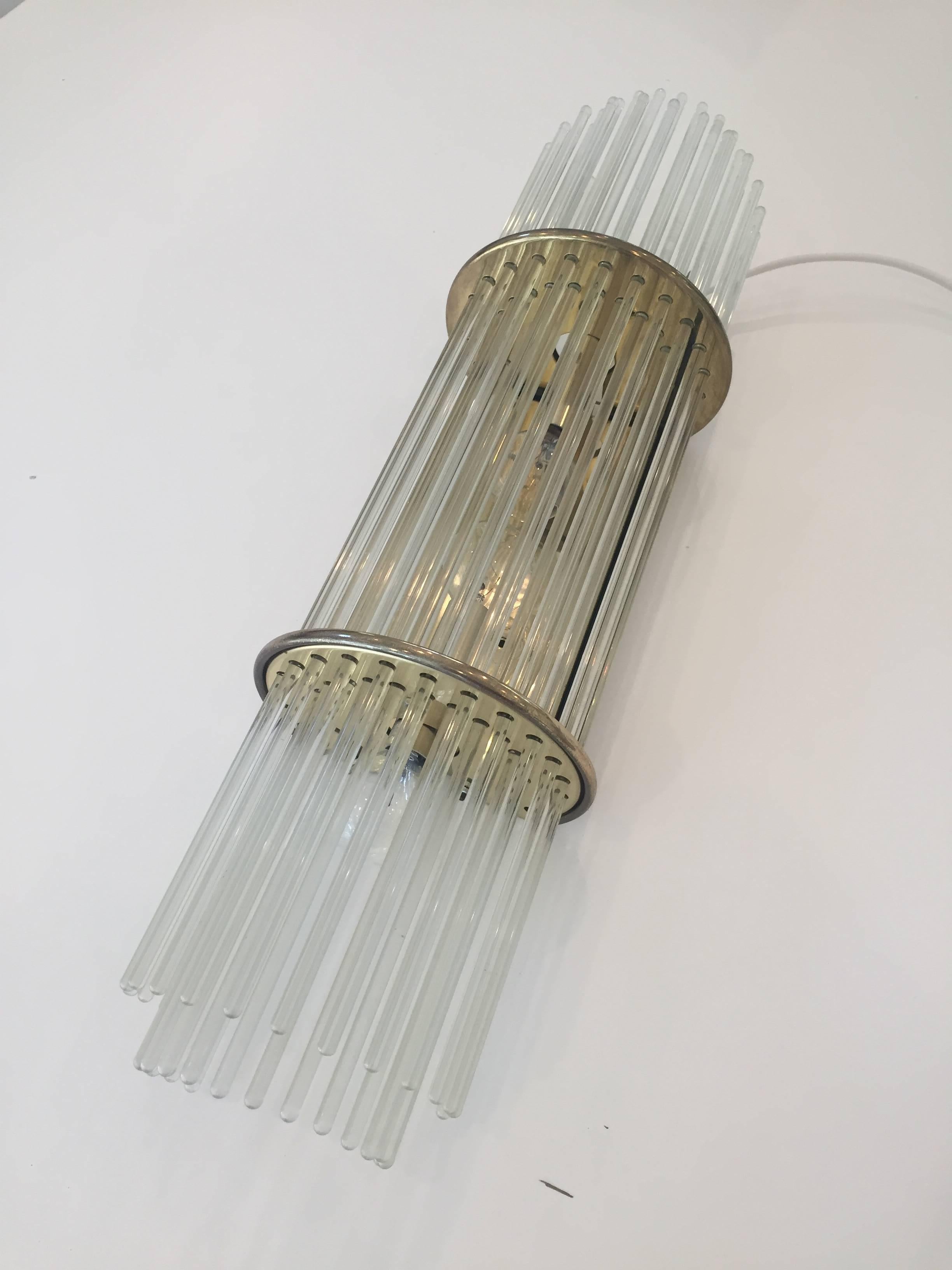 Mid -Century Italian brass sconce with glass rods. In proper working order.