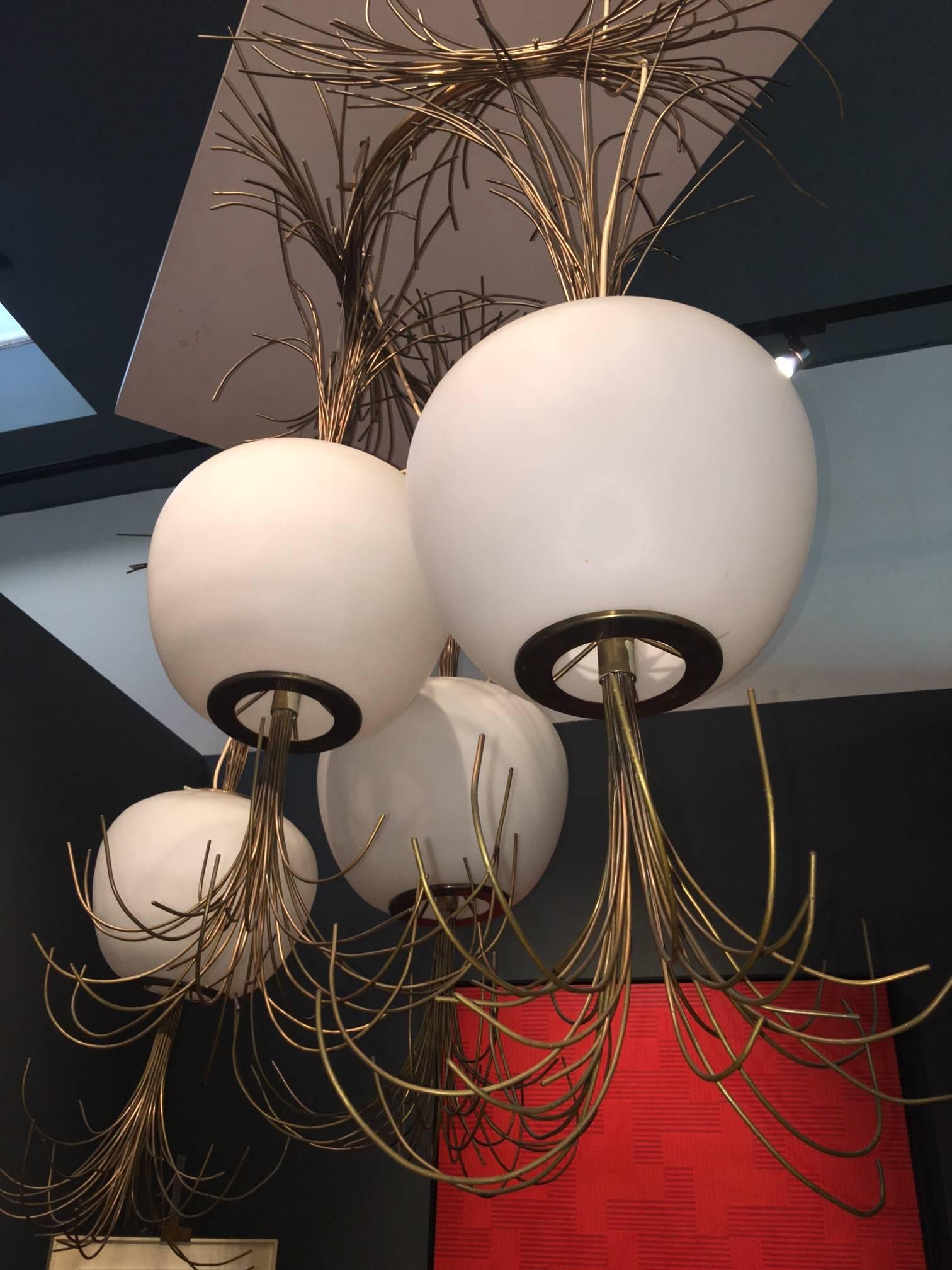 Consisting of four brass trimmed Murano Opaline glass globes with a profusion of thick brass filaments riotously emanating from their upper and lower sections.

This piece is unique and from one of the most desired contemporary artisans.

CA,