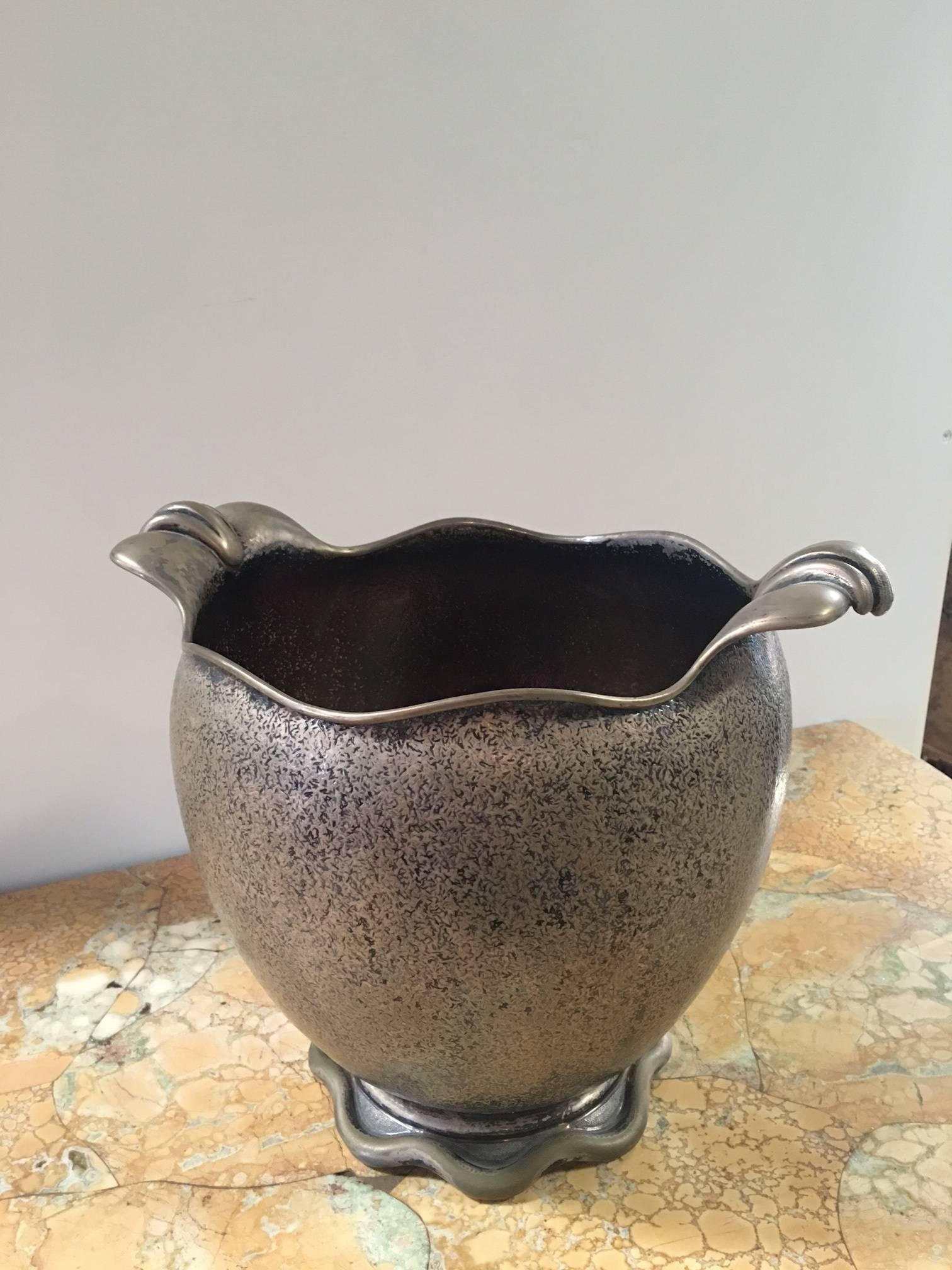 Stylized with flanged handles,

Milan,
circa 1935-1940.