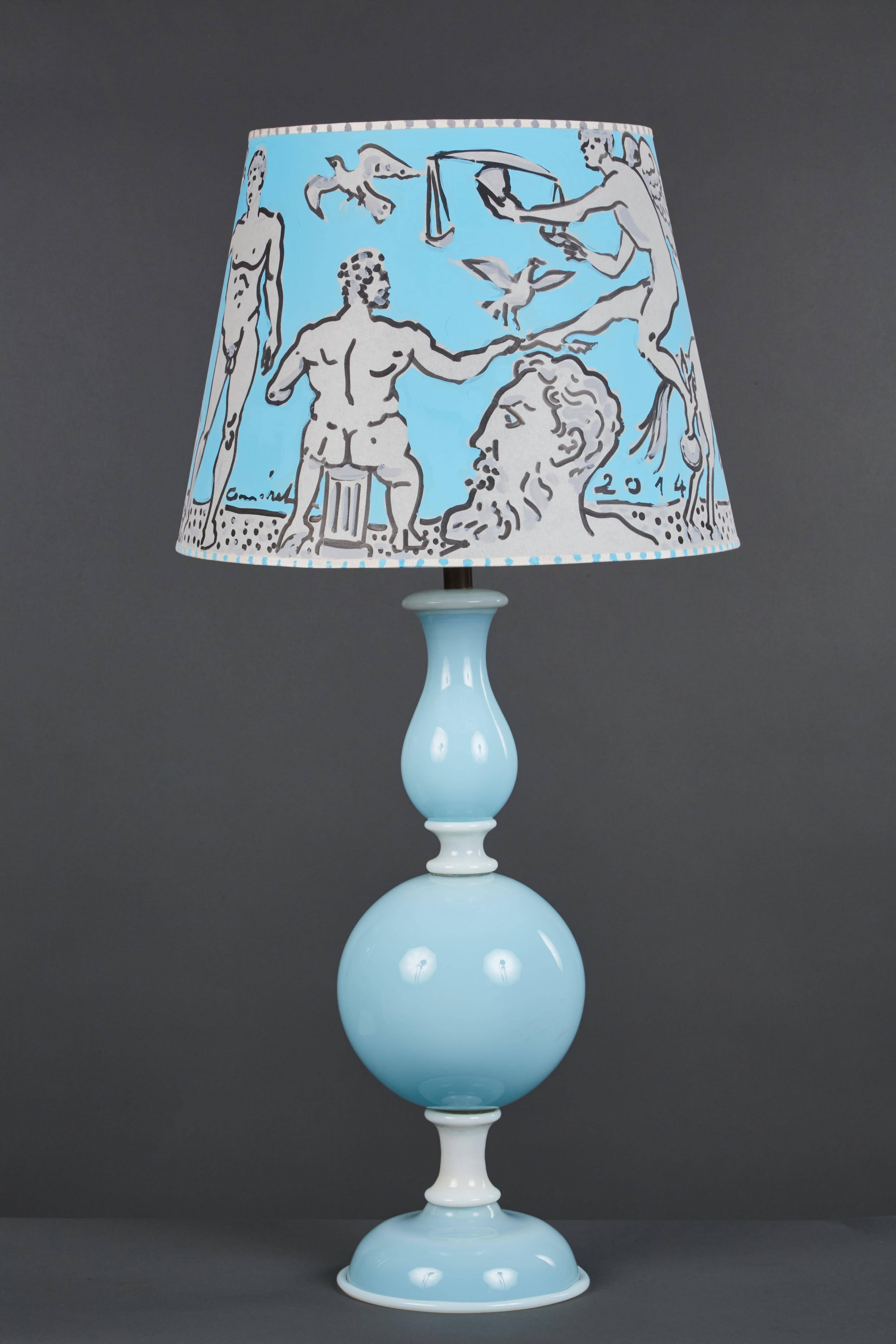 A pale blue and white Murano glass table lamp in the style of Venini, circa 1955, with an elegant hand-painted shade by Ivan Komerek.

 