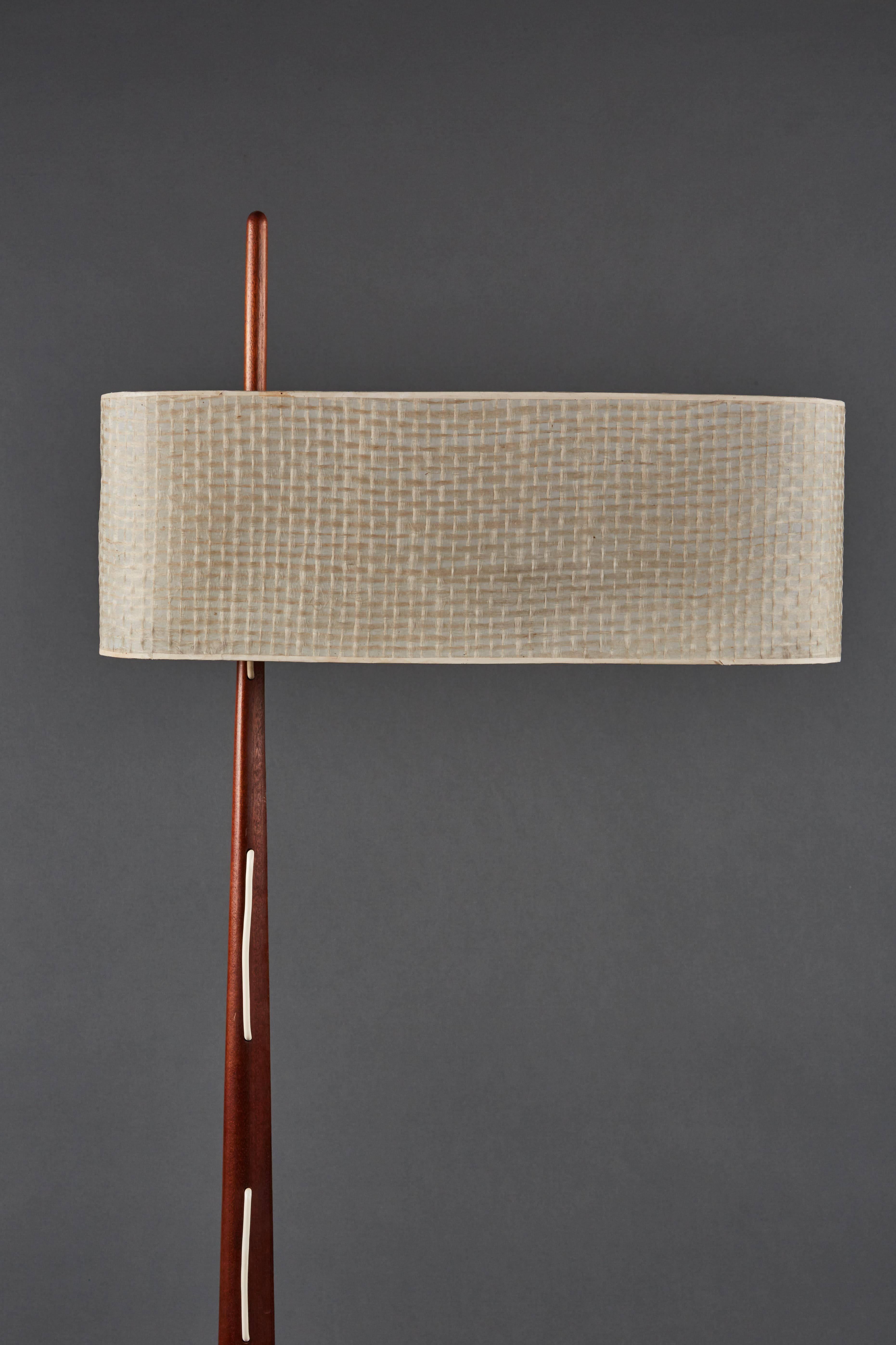 Elegant French floor lamp by Rispal featuring a table and the original shade. Beautiful and very sculptural.