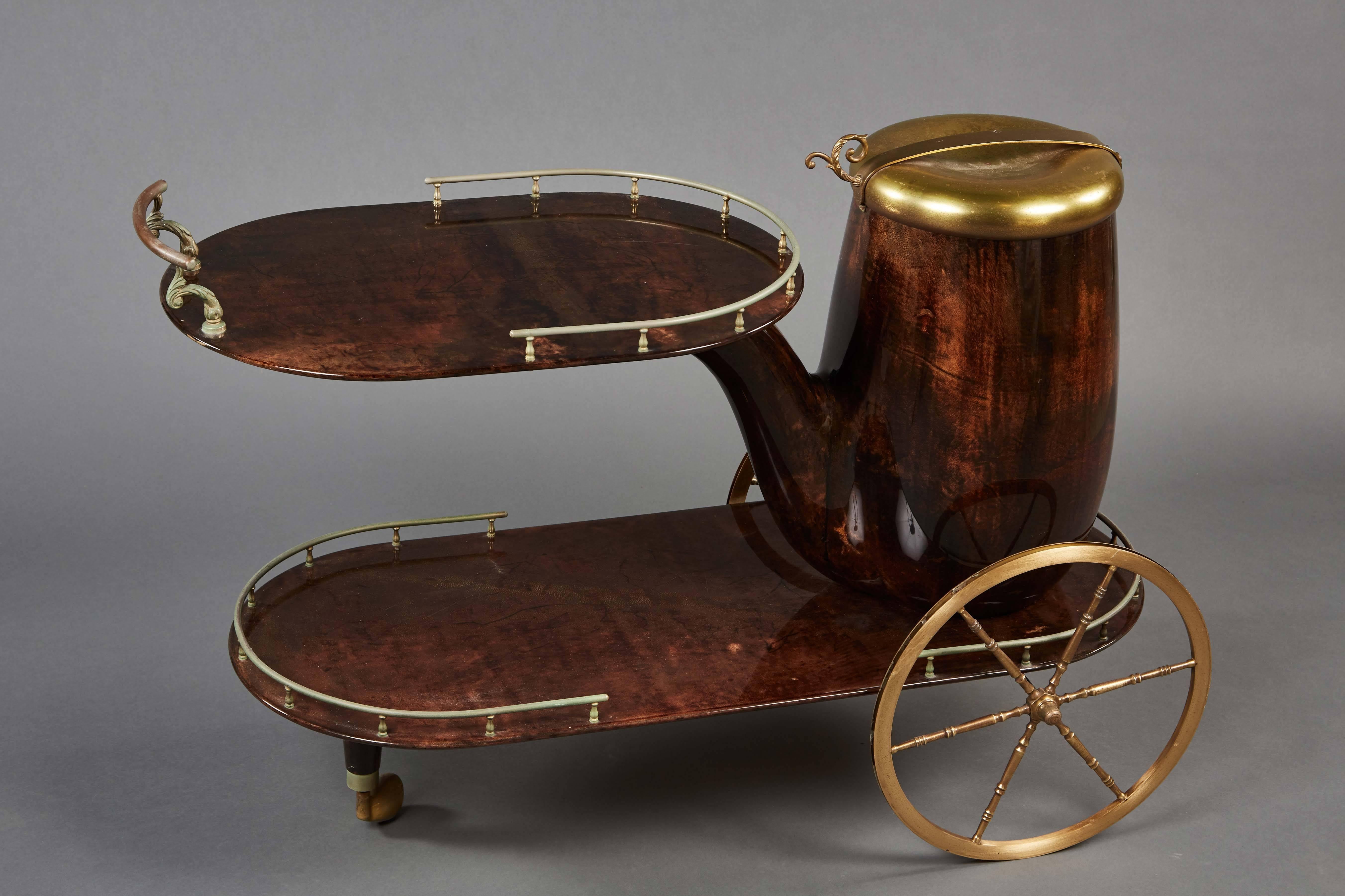 Sheathed in pigmented and lacquered goatskin, with brass appointments and spoked wheels.