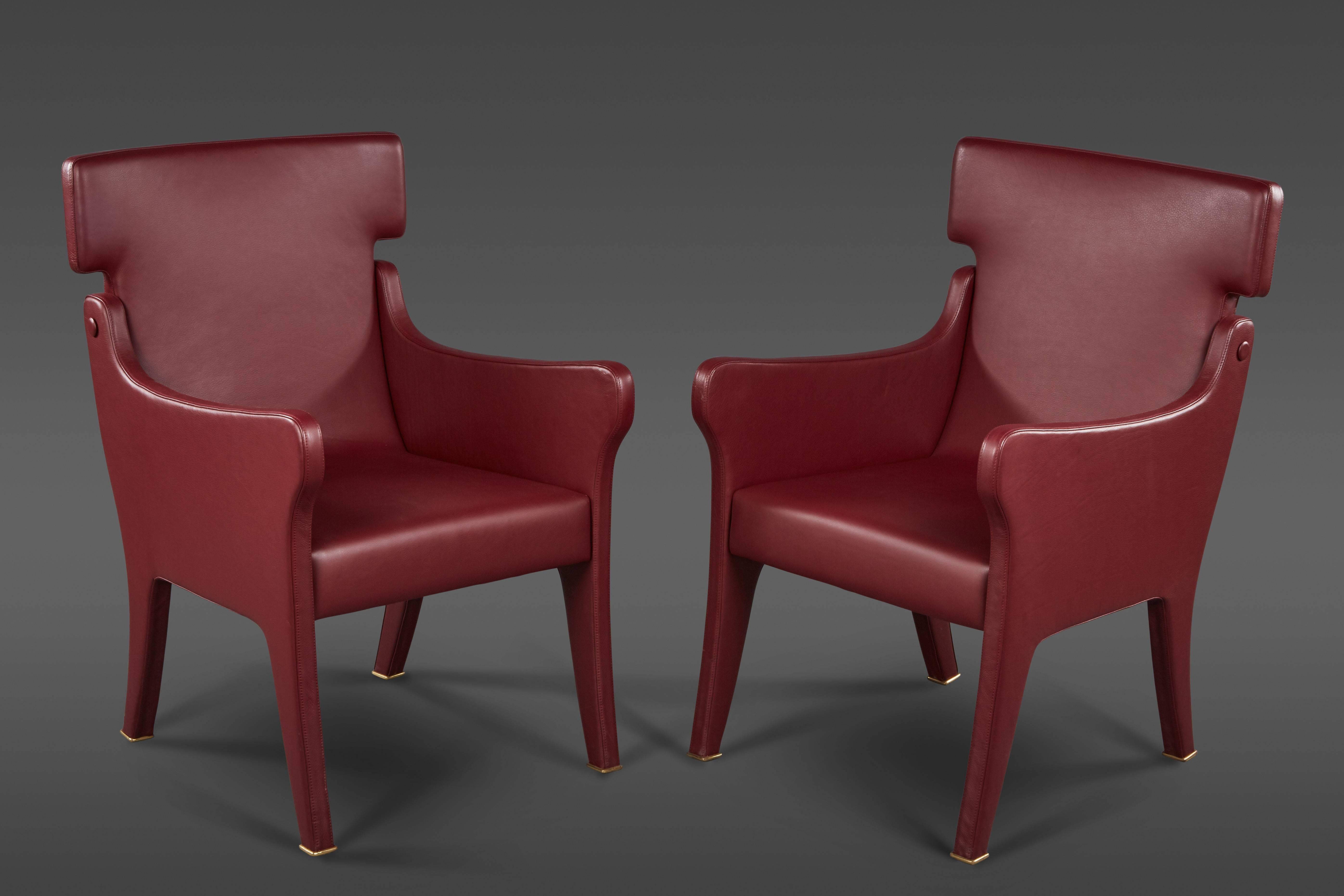 A pair of sculptural Ignazio Gardella leather chairs with brass sabots for Azucena.