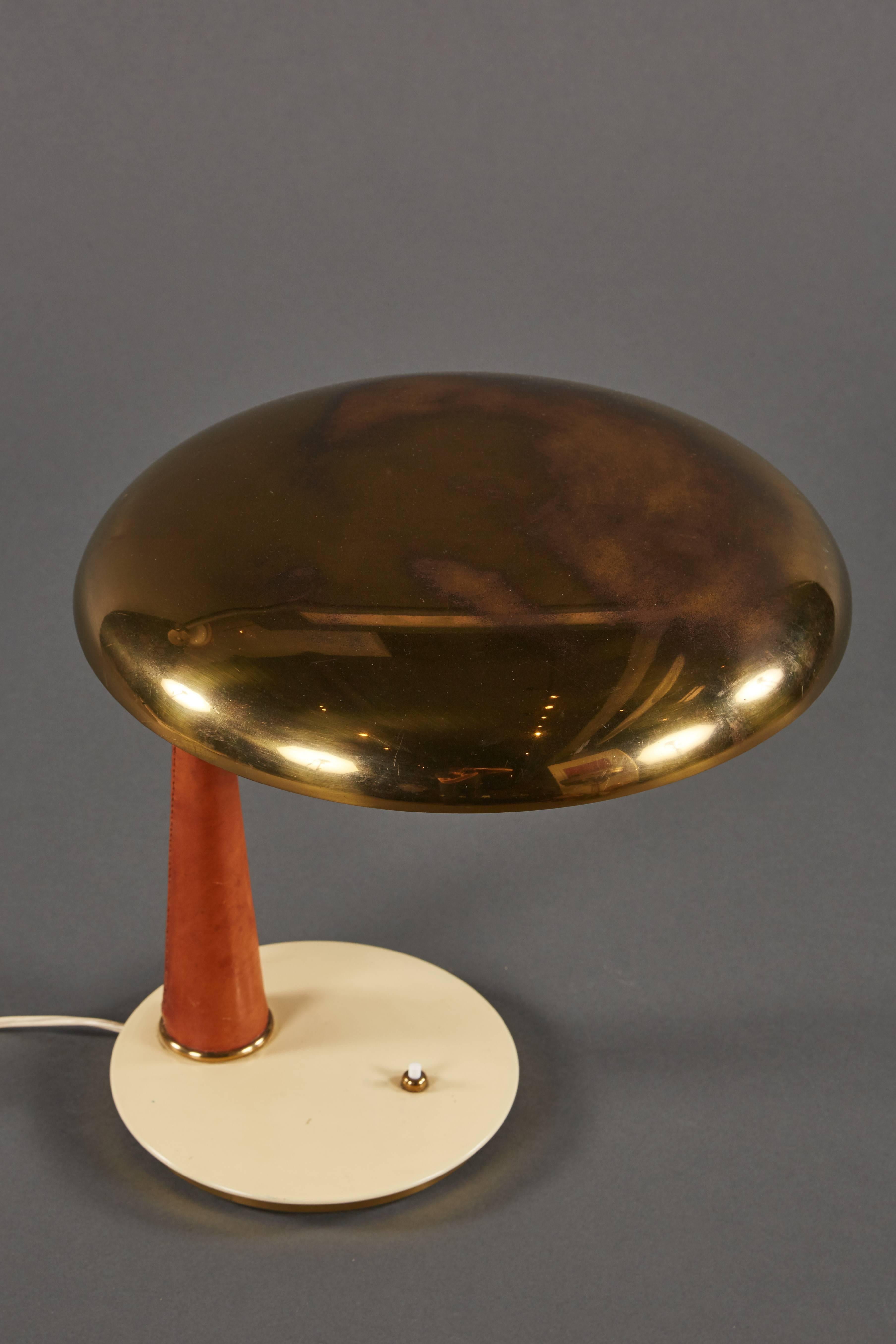 20th Century Striking Angelo Lelii Leather and Brass Table Lamp for Arredoluce For Sale