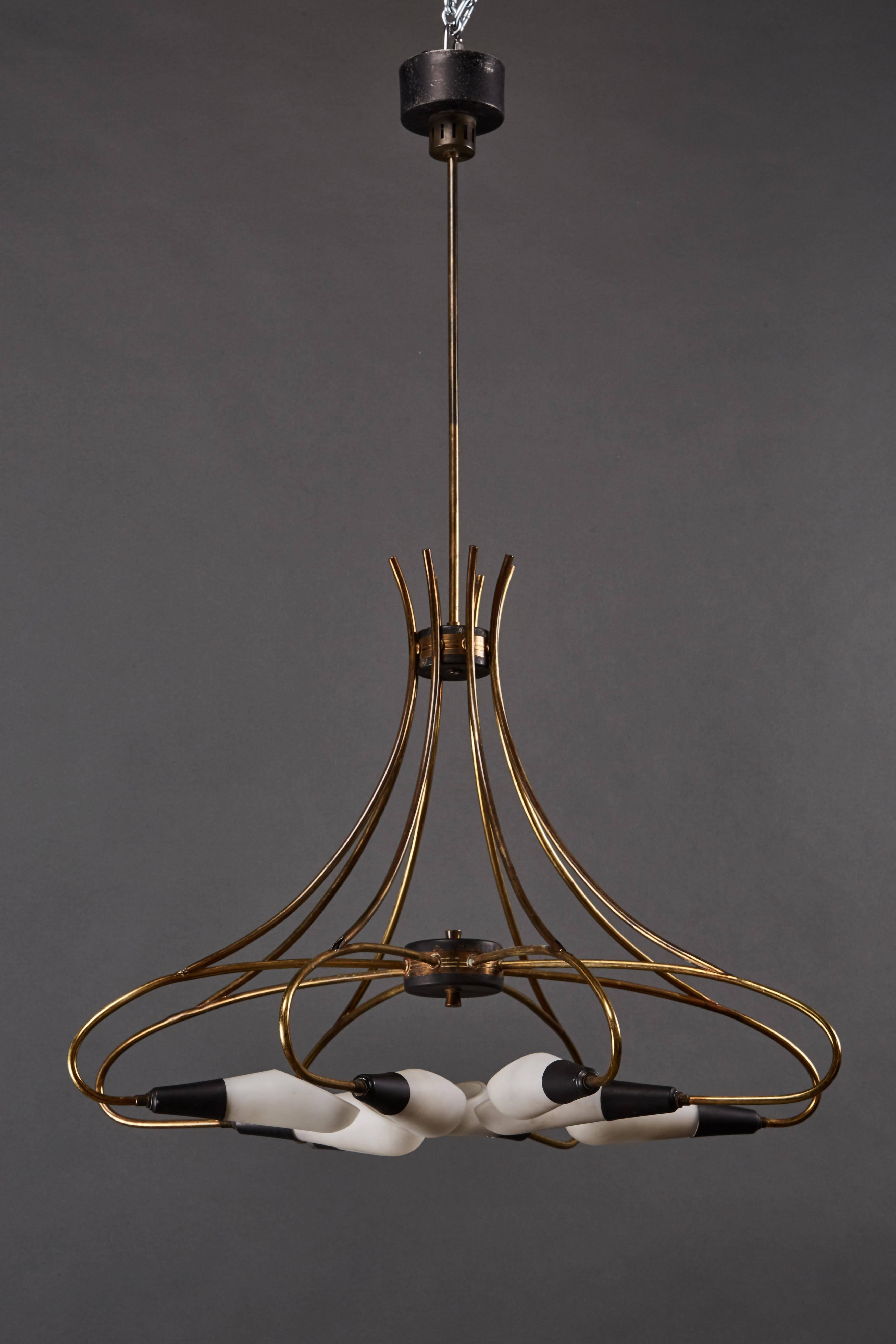An elegant curvilinear Italian Stilnovo eight-light chandelier.
