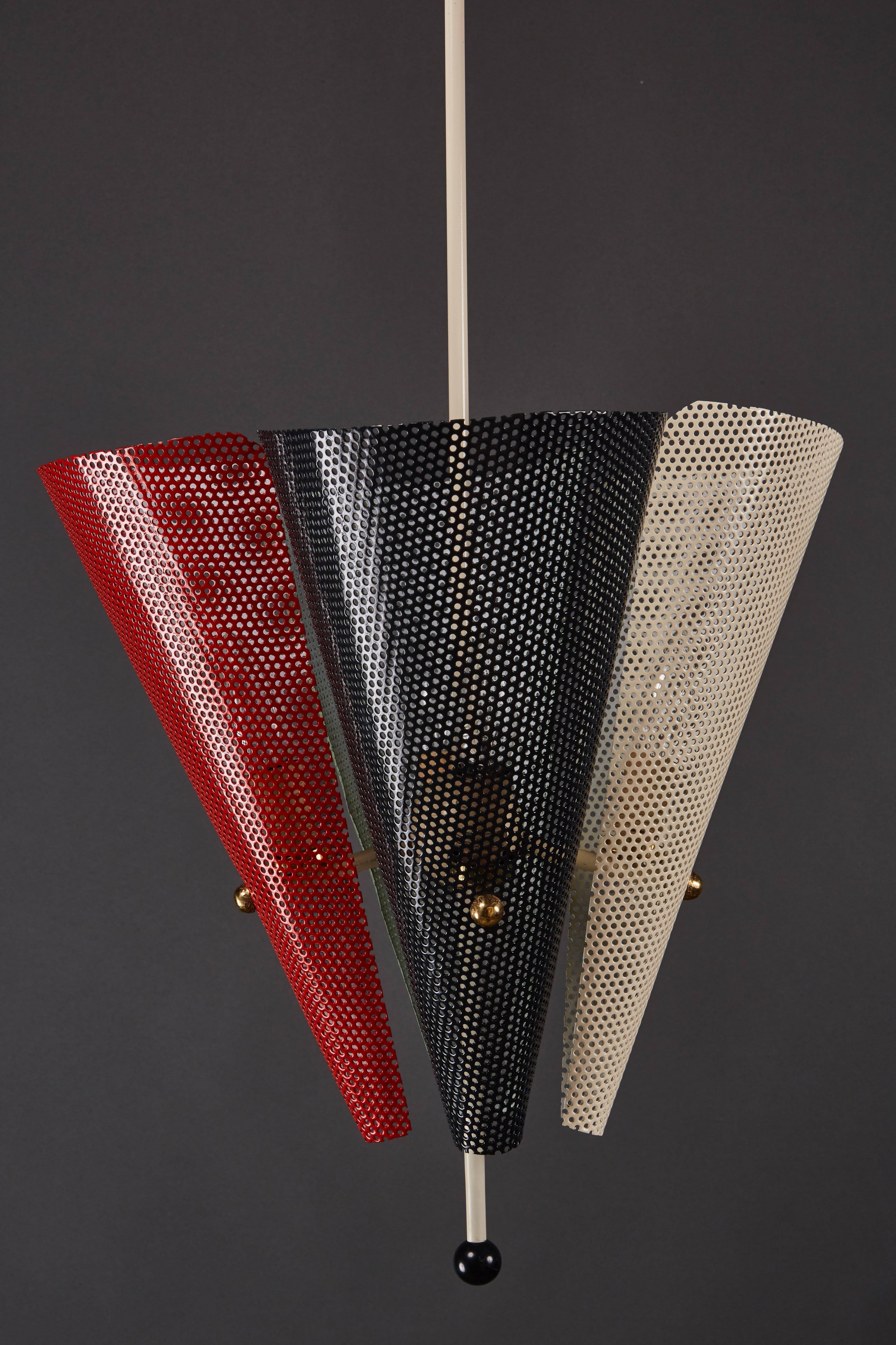 An unusual French perforated metal multicolored ceiling pendant attributed to Mathieu Mategot. Enameled metal with brass details.