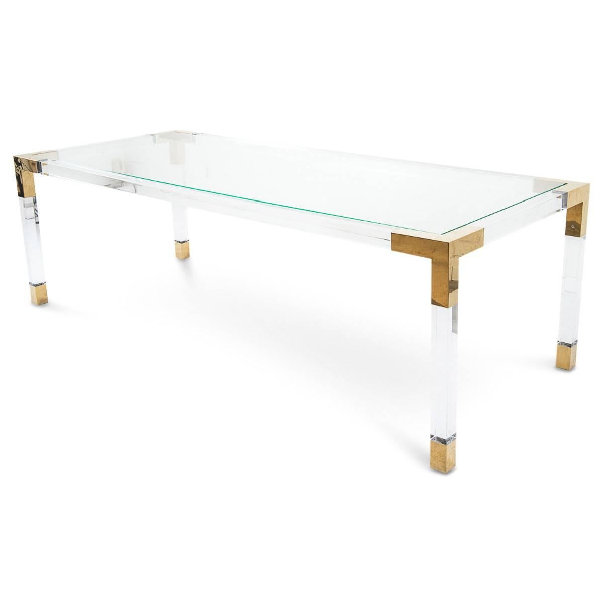 Whip your dining into shape with this beautiful Lucite dining table. This is the perfect addition to our Classic Trousdale look of brass and Lucite. This comes with an inset star fire glass top.

Dimension

96