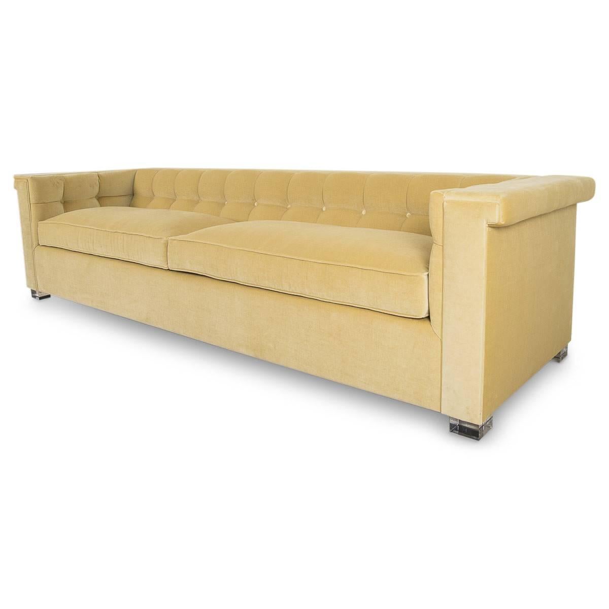 This is the kind of sofa you can have in a lounge or a study and it just sets the mood. Completely tufted in rich, smooth Como Mustard velvet. This sofa has all the style and cool that one can ask for. From the deep seat to the wide arms, it's ready