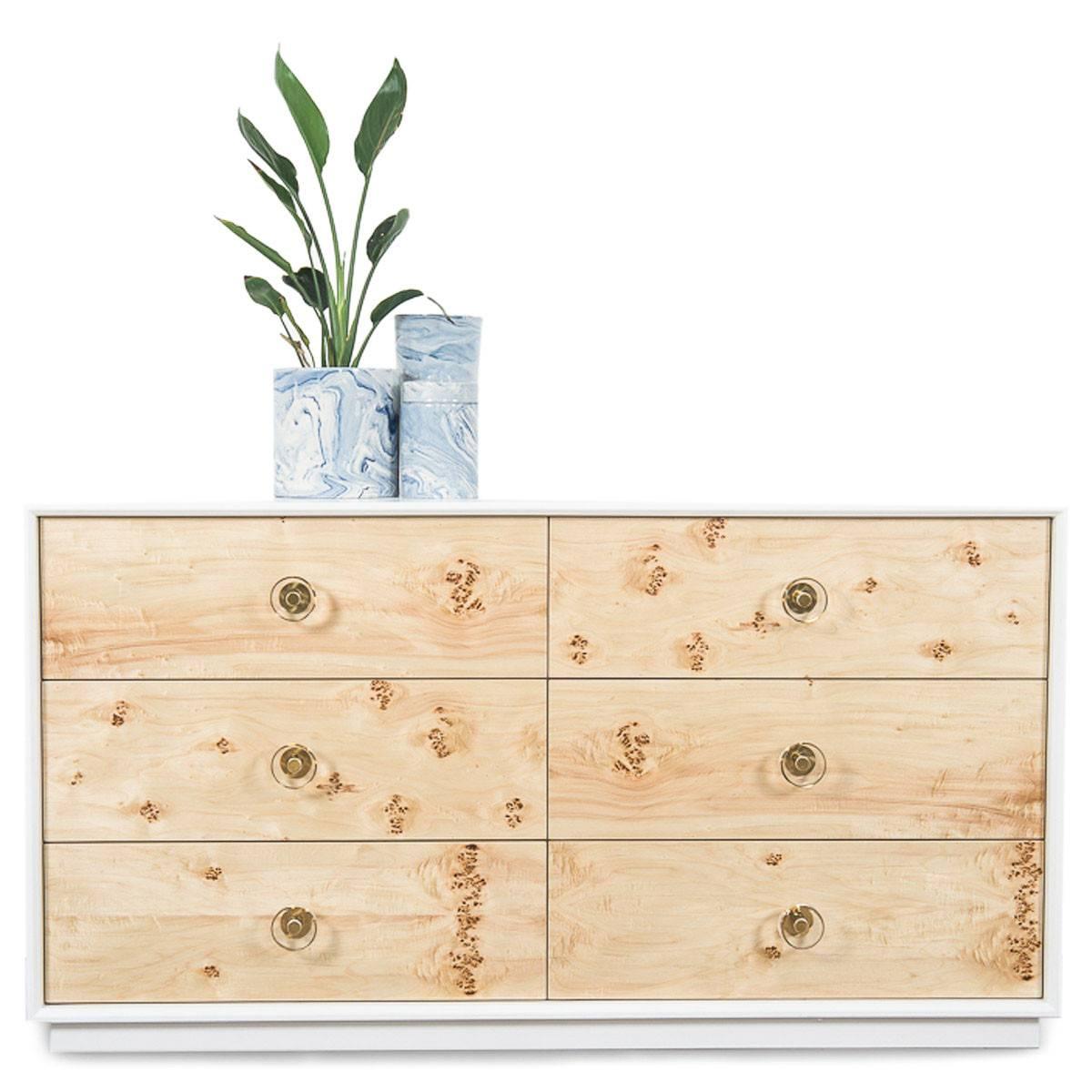 white dresser with wood drawers