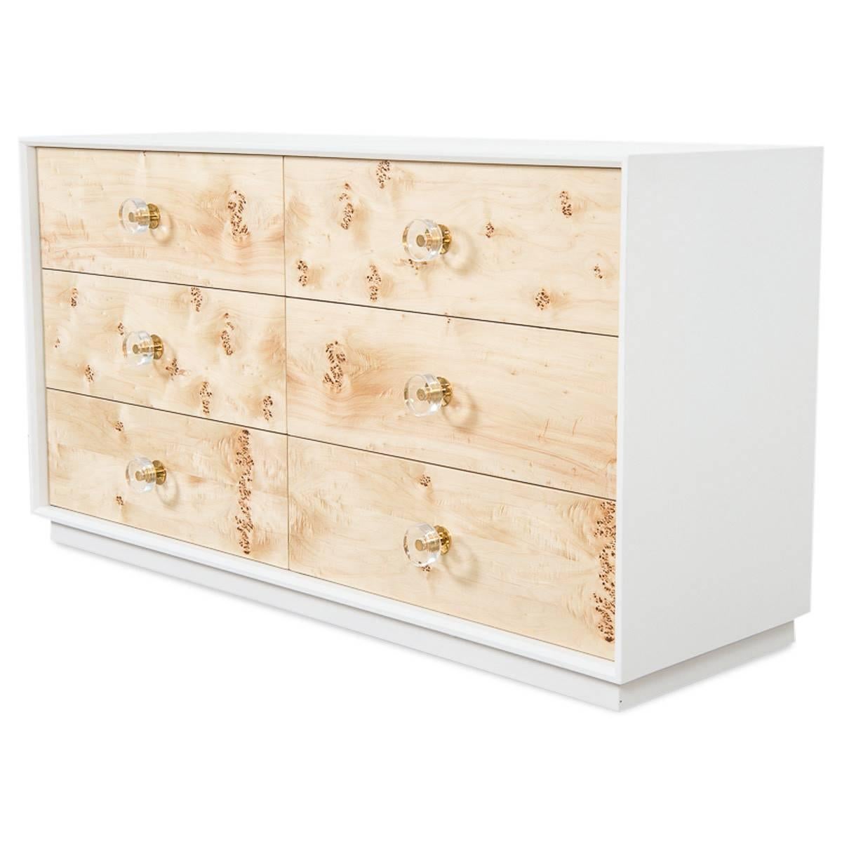 This dresser is finished in a burl wood veneer, showcasing the natural beauty of this type of wood. The six drawers have Lucite and brass pull handles, surrounded in matte white lacquer beveled edge case. 

Dimension:

60