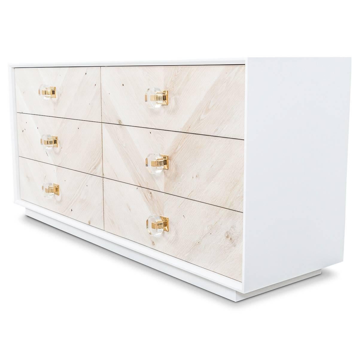 This new credenza uses a bleached rift oak door fronts made in a wide chevron pattern. Coupled with our Hexagon Lucite knobs makes this a perfect addition to any bedroom.

Dimensions