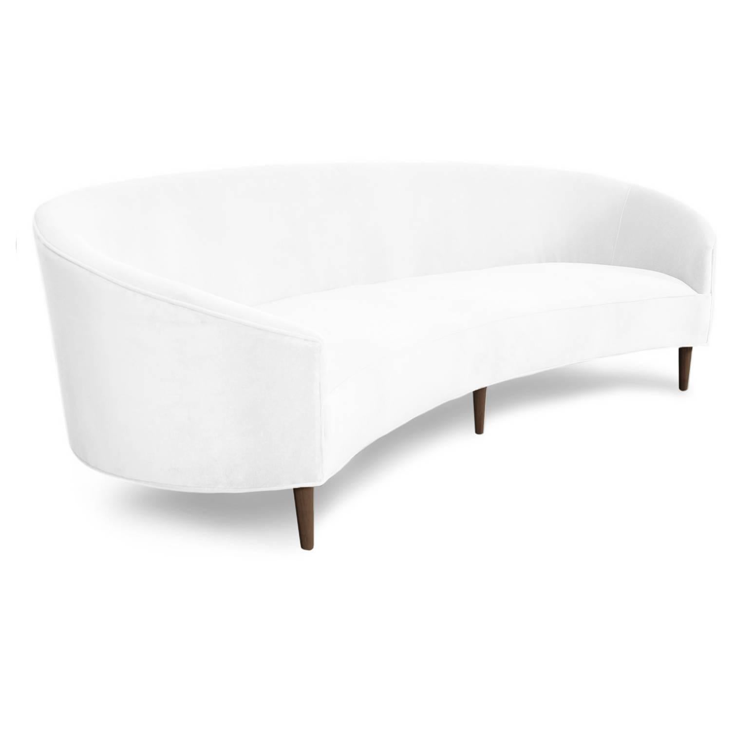 With classic clean lines and sharp curves comes Modshop's Art Deco sofa. Uniquely shaped, similar to a crescent, curved in arms and six walnut cone legs put together in elegance. Shown in snow velvet.

Measures: 105