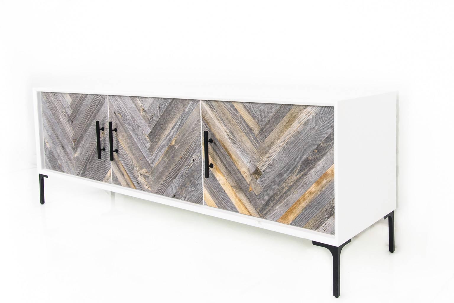 The Amalfi 3 door credenza with recycled wood doors is perfect for any space. Encased in a matte black or white finish, the wood planks on the doors create a large herringbone effect.  

Dimensions:
72