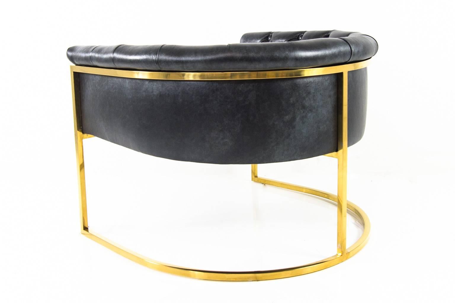 The Lisbon chair is a brass and black leather chair.
The leather is tufted, and sits on top of a brass frame.

This is a made to order piece, for additional chairs please contact us. 

Measures: 33
