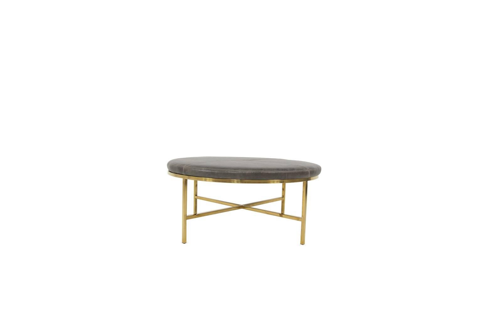Modshop's Milan ottoman comes in leather and brass legs. 
This is a made to order piece. 

Measures: 17