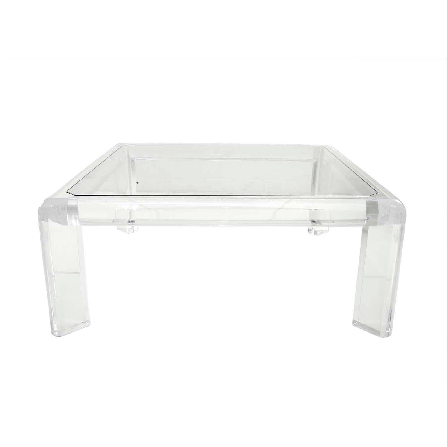 Modshop's homage to the 1960s with the
1960s Lucite and glass coffee table.

Measures: 38.5