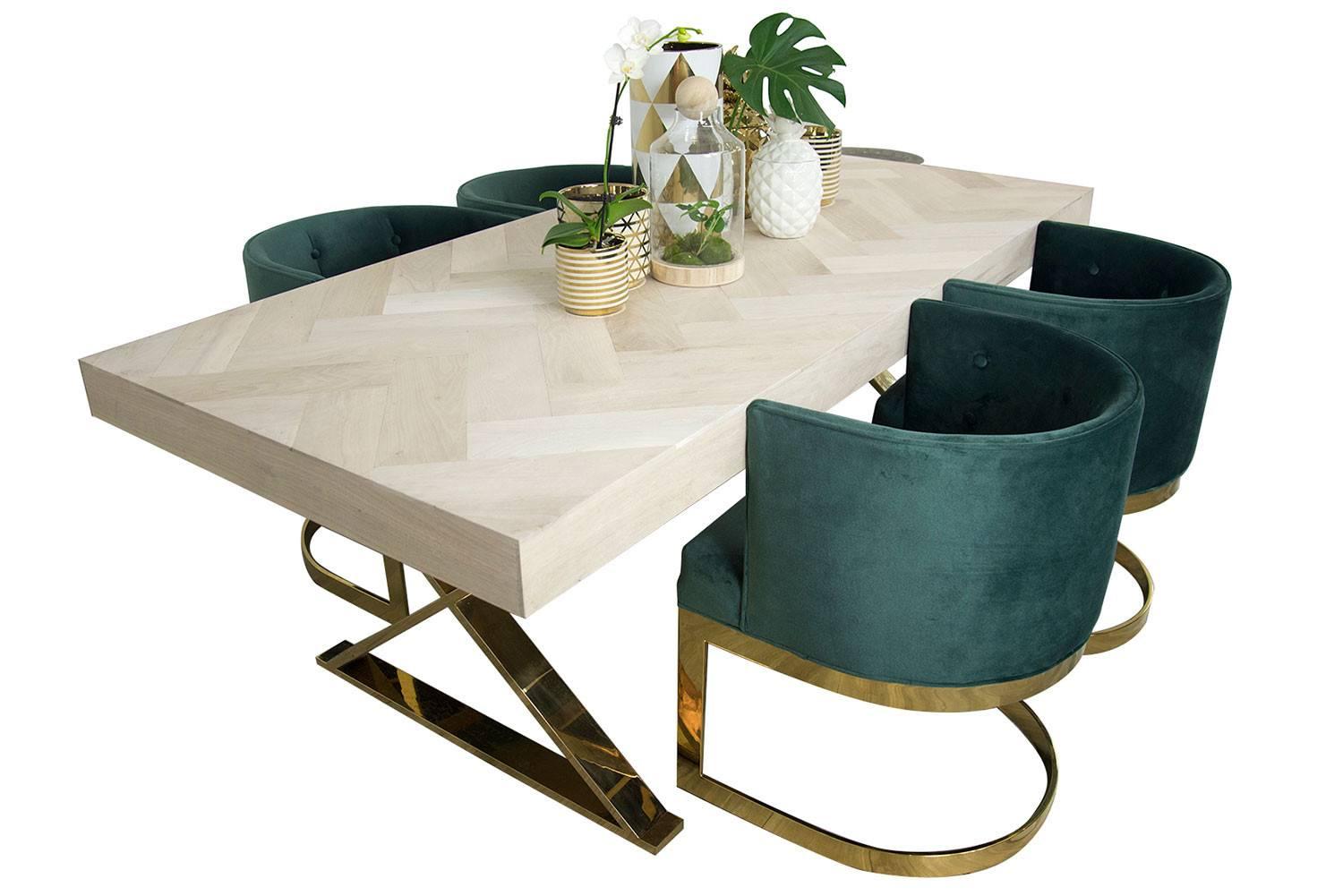The Amalfi dining table is a wonderful addition to our Amalfi Collection. The top is made of solid bleached walnut that is carefully laid out in a herringbone pattern. The table is supported with two elegant brass X-legs.

Measures: 7' long / 38