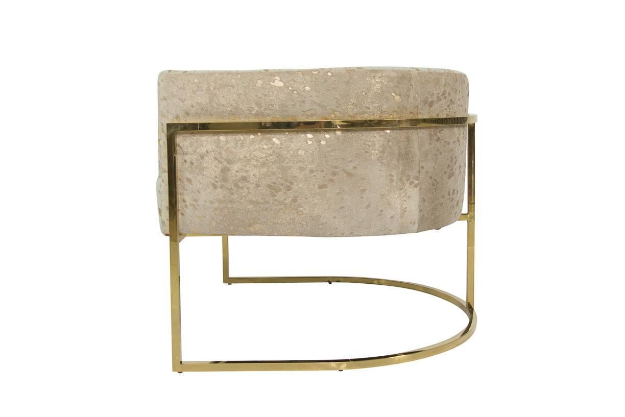 Brass and gold speckled cowhide creates the stunning look of the Lisbon chair. A dramatic chair with slim brass frame, is perfect for creating a stunning seating area in any room.
         