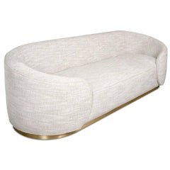 Curvy Wrap-Round Sofa with Brushed Brass Base and Textured Linen Upholstery