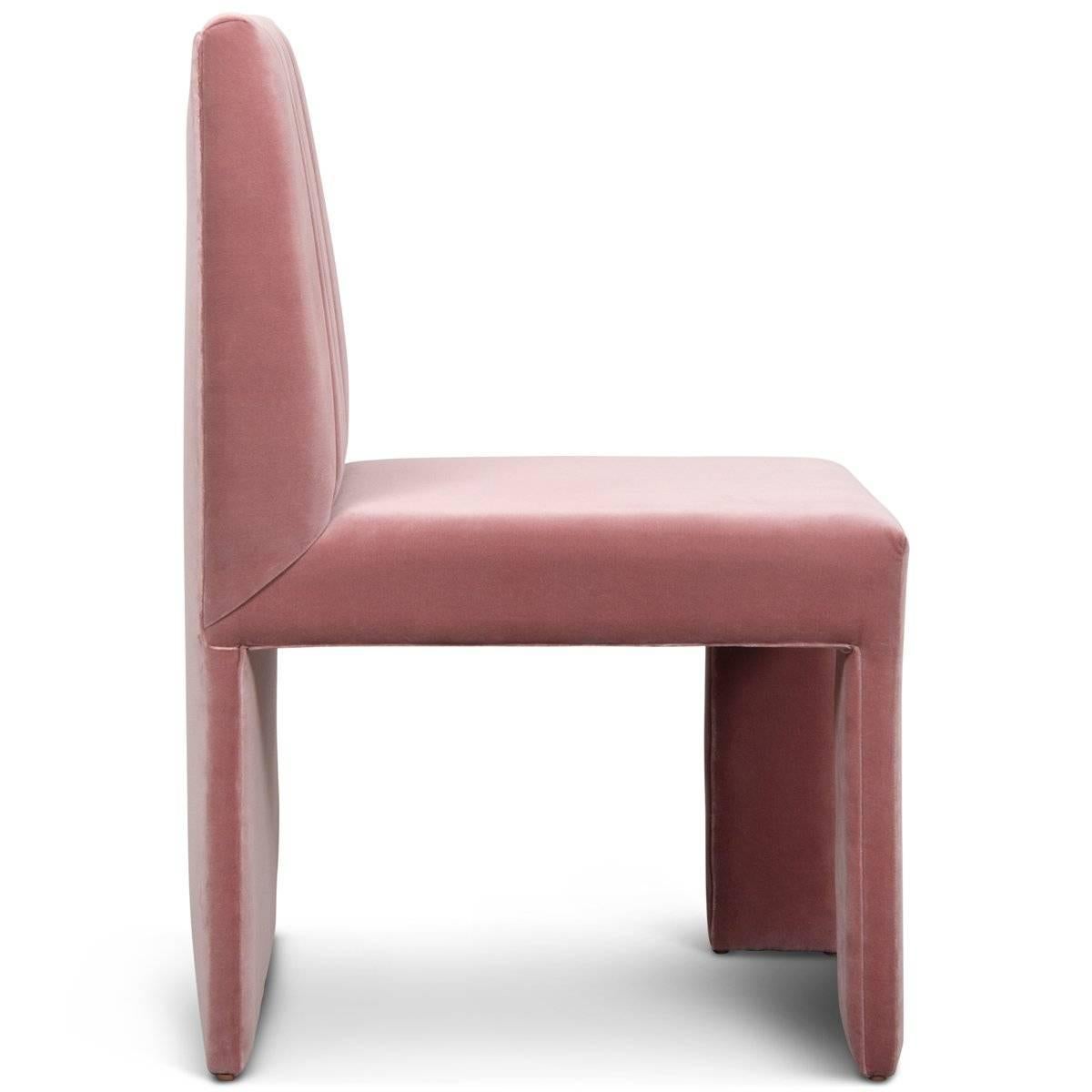 The St. Martin dining chair was designed as a perfect blend of form and function. Featuring a strikingly different profile from every angle, the St. Martin Dining Chair in mauve velvet has an appealing balance of negative and positive space. No