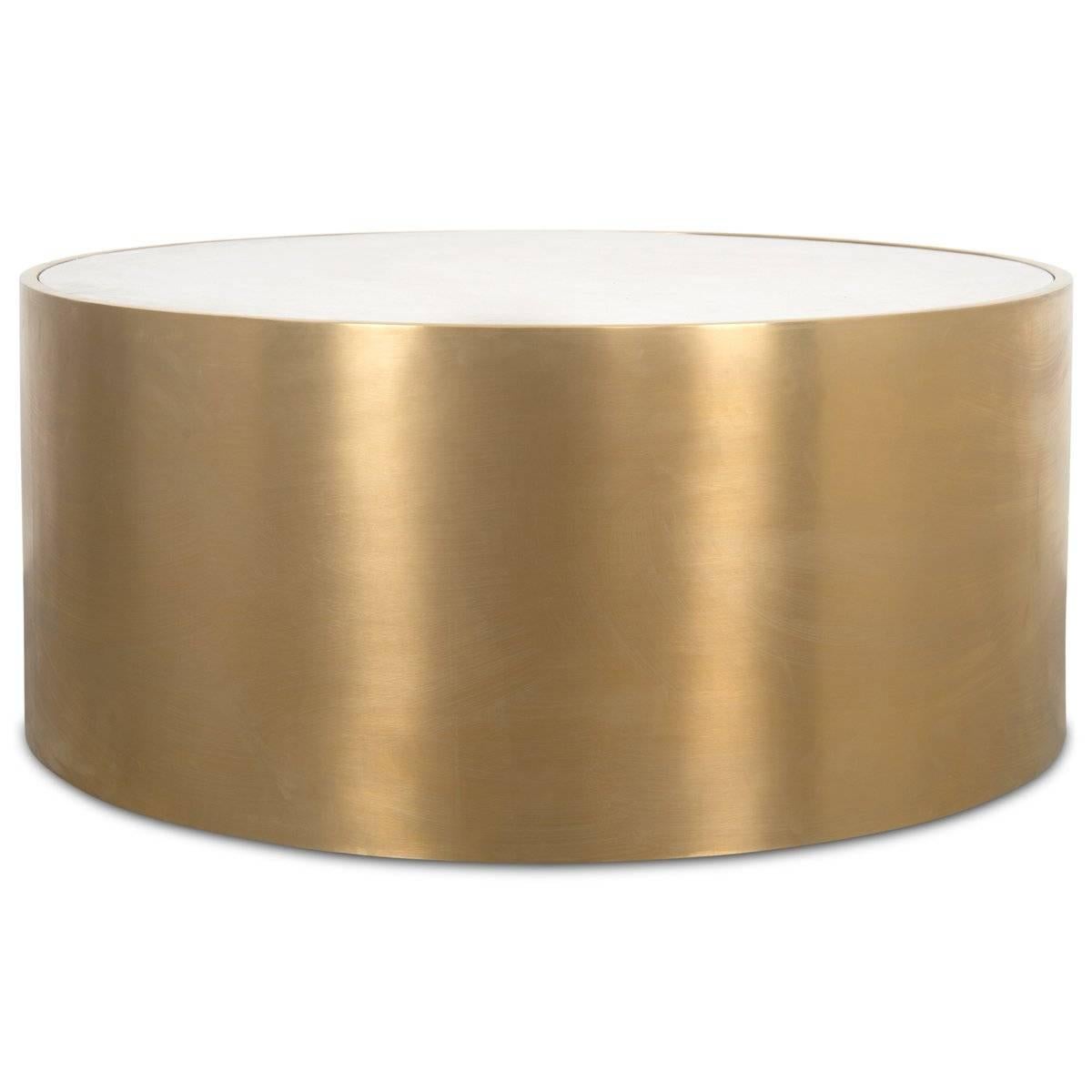This beautifully handcrafted coffee table is sure to impress. Featuring a stone-like concrete top in a soothing vanilla color and long brushed brass exterior, the Leon Coffee Table is bold and impactful in any space. 

Dimensions:
41.5