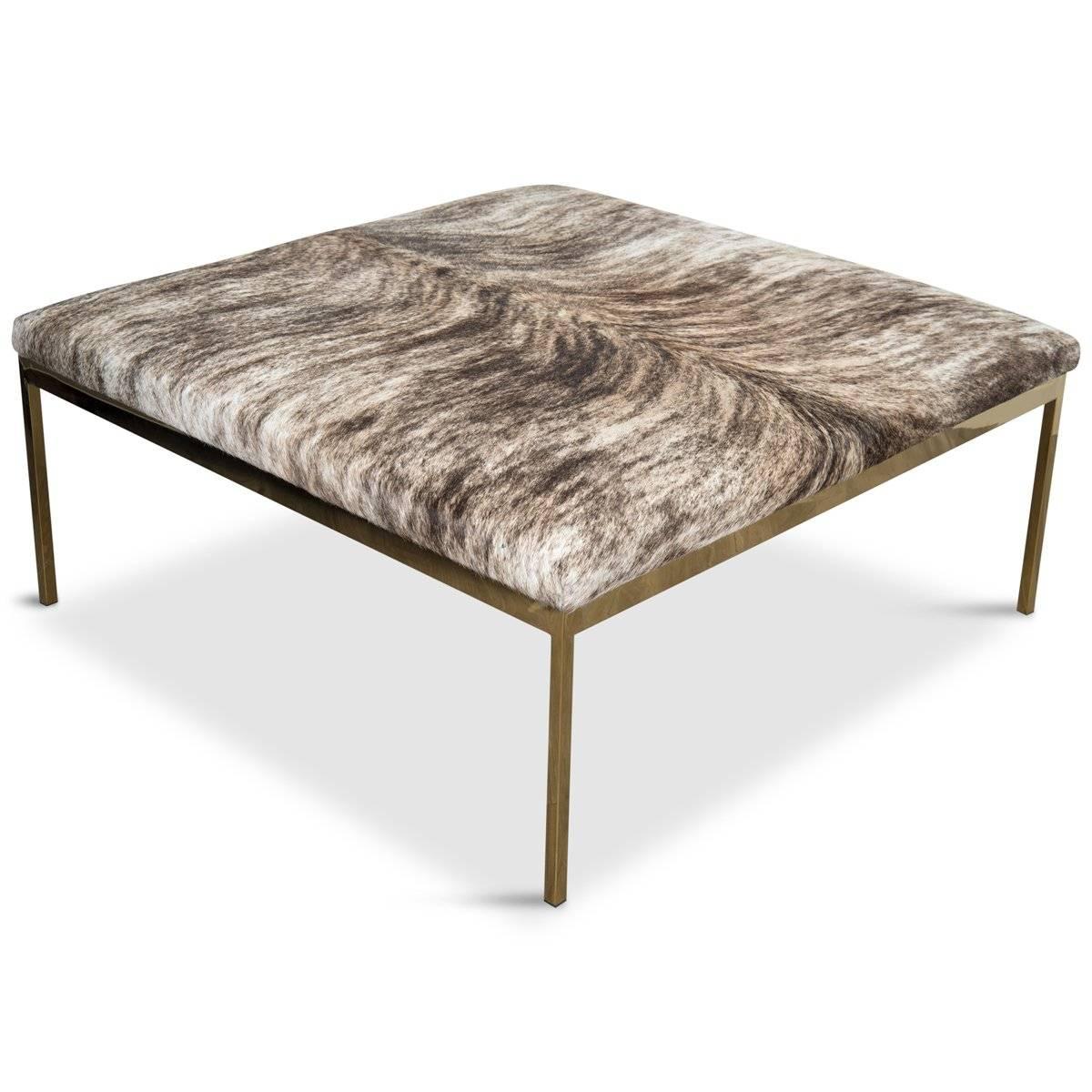 The Bordeaux ottoman has a simple, classic, yet elegant brass frame. Finished with brindle cowhide, the Bordeaux ottoman is the perfect centerpiece for any living room. 

 Dimensions:
41