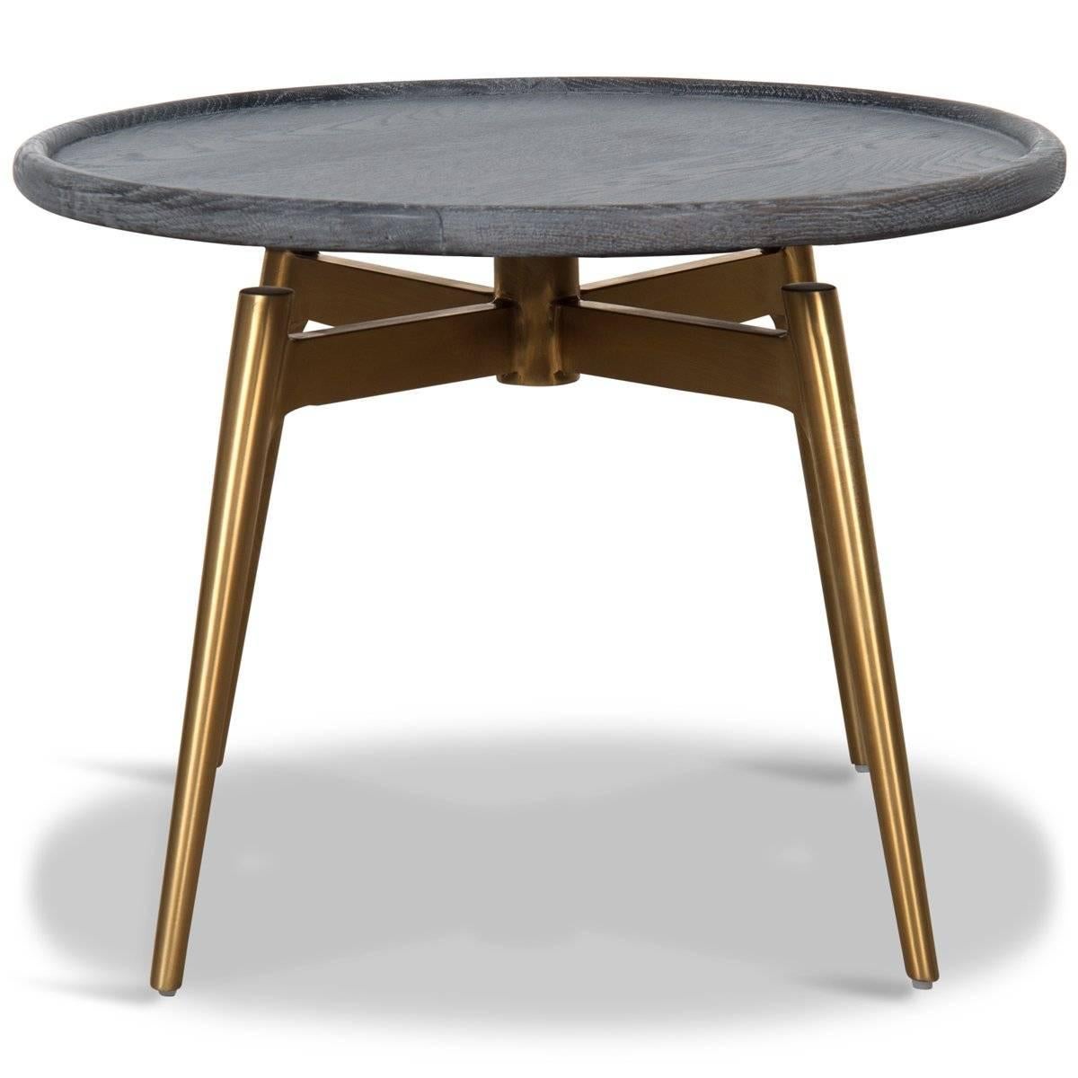 Featuring a round light charcoal wood top and angular brushed brass legs, the Copenhagen Side Table is a beautiful modern addition to any living room or bedroom. The natural wood texture and the industrial charcoal and brass colors blend for a clean