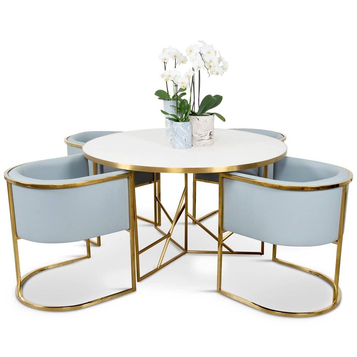 The Martinique dining table is the newest addition to the Martinique collection. The top of white stone-like concrete and the geometric negative space in the legs contrast to create perfect visual balance. Featuring a brushed brass frame and base