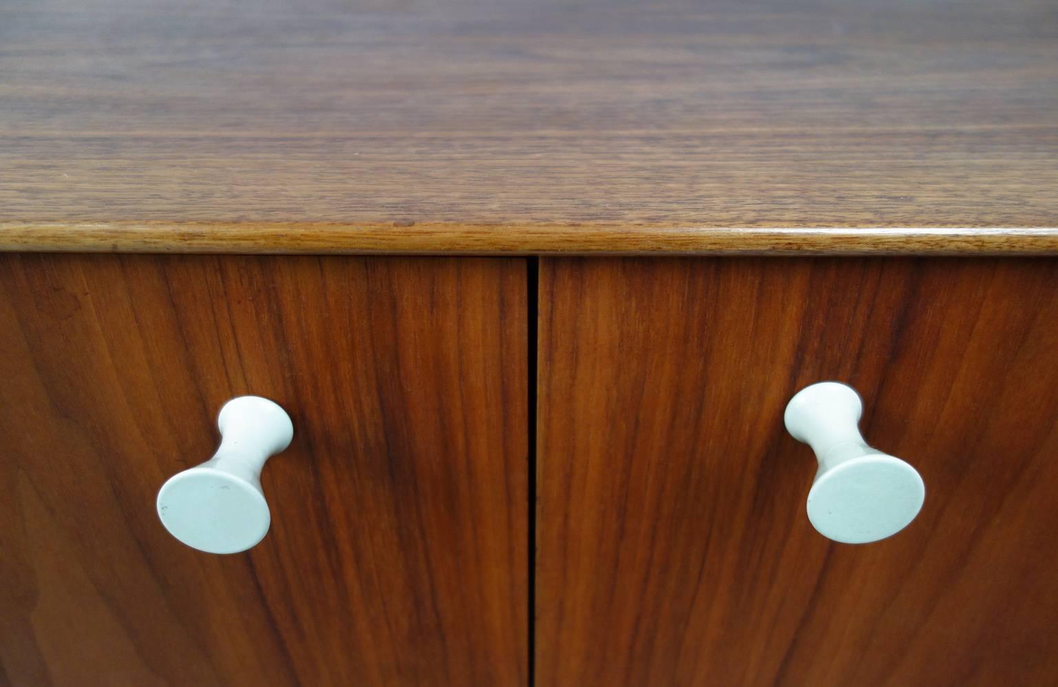 Beautiful George Nelson for Herman Miller thin edge sideboard / credenza. Early example with brushed aluminum legs and porcelain handles. Label intact.