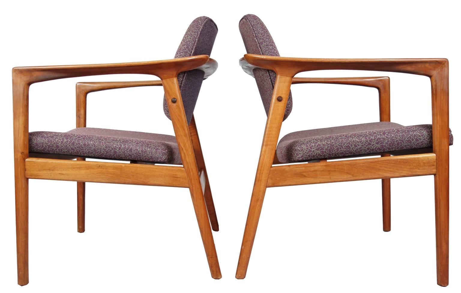 Very nice condition Folke Ohlsson easy chairs for DUX. Ohlsson pioneered the export of Scandinavian design to America in the 50's. He created the concept of flat packed furniture. Paving the way for other designers such as Grete Jalk, Hans Wegner,