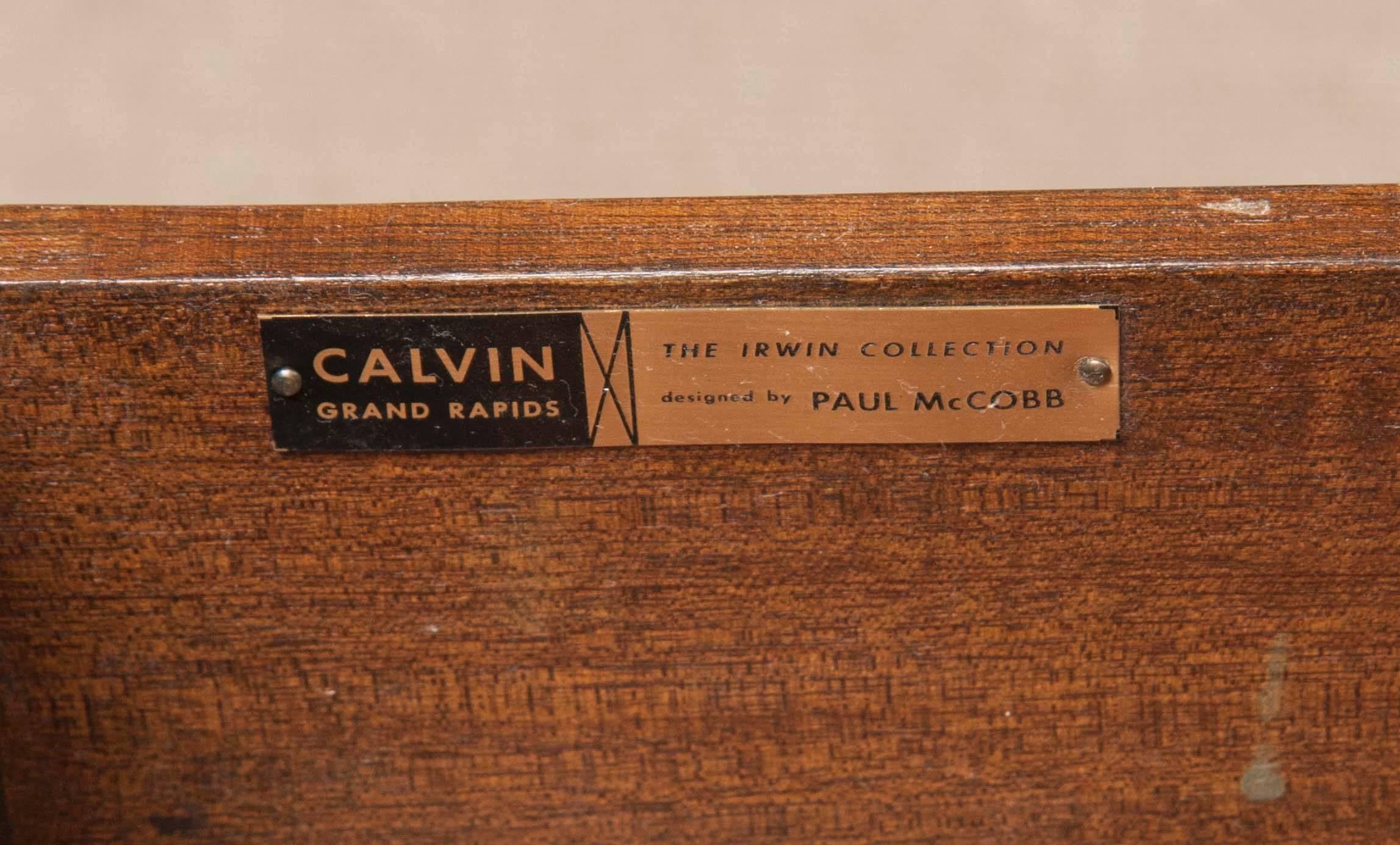 Offered for your consideration is a fully refinished credenza by famed American designer Paul McCobb for the Calvin Group. The credenza, part of the Irwin Collection, features a mahogany casing and brass trim. Six panels open to expose interior