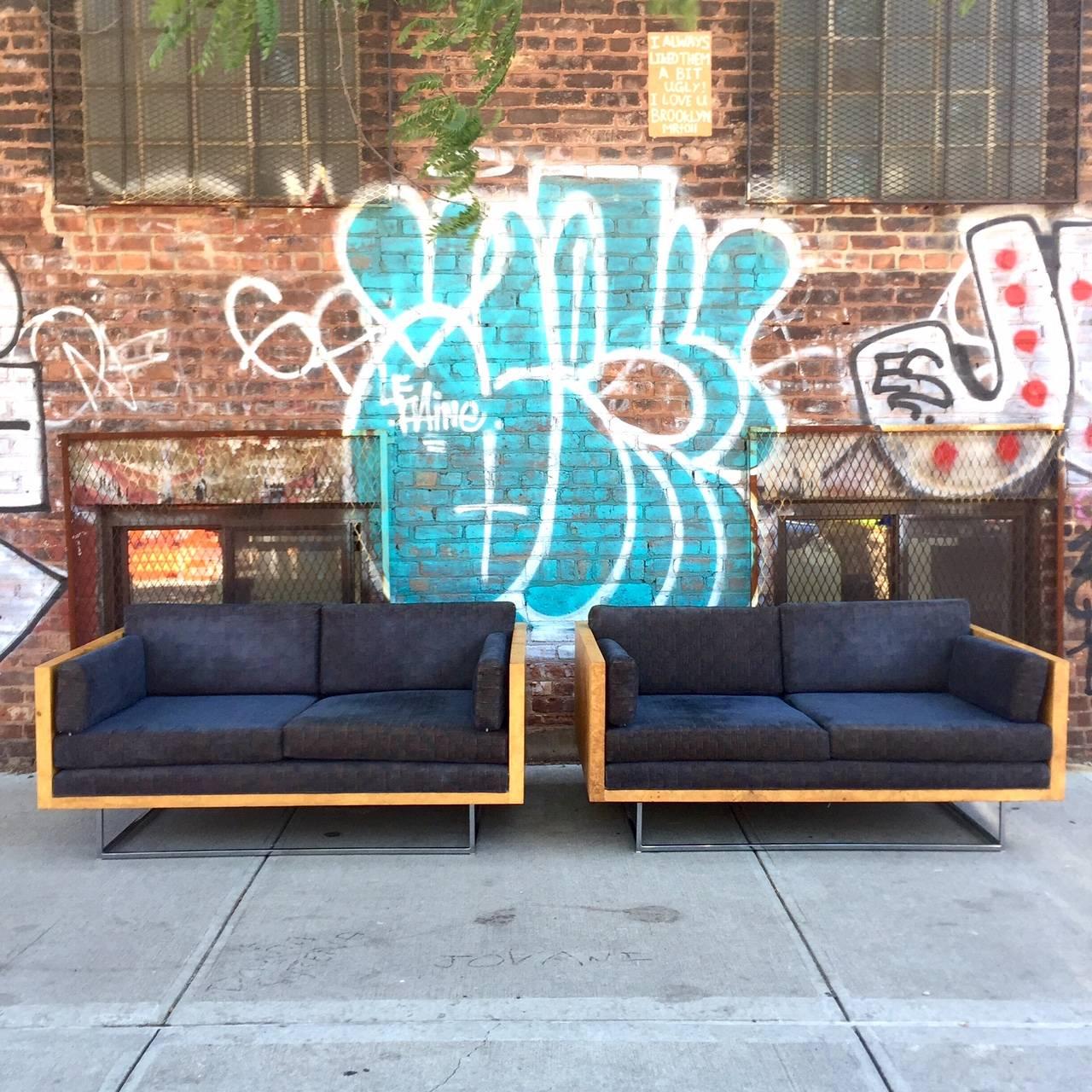 For your consideration is a striking pair of Milo Baughman for Thayer Coggin tuxedo case sofas.

The loveseats are housed in burl wood olive frames and float atop thin chrome bases.

They are in excellent vintage condition.

Ready for a light