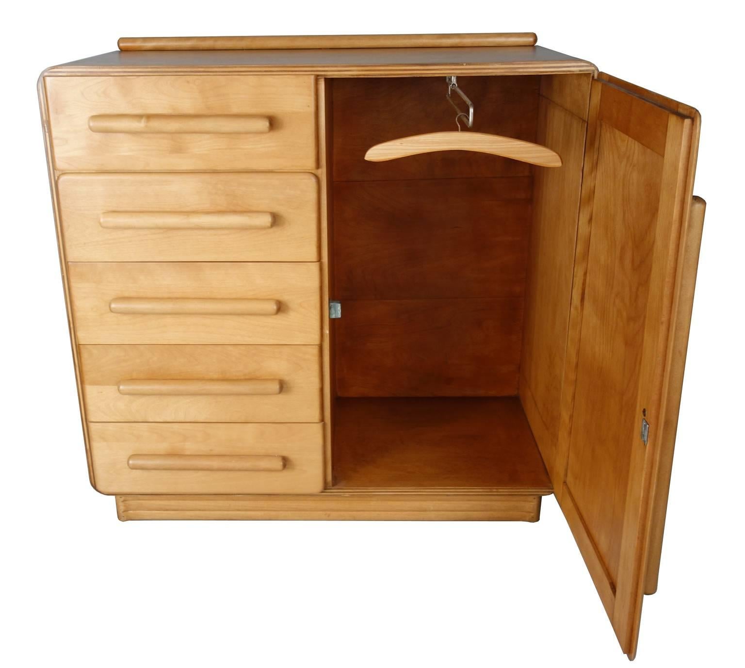 Hard to find a Mid-Century changing station. This solid and well-made cabinet is constructed with a combination of solid maple and maple ply. Has a nice warm glowing patina. No identifying markers. In the sale of Heywood-Wakefield and T.H.